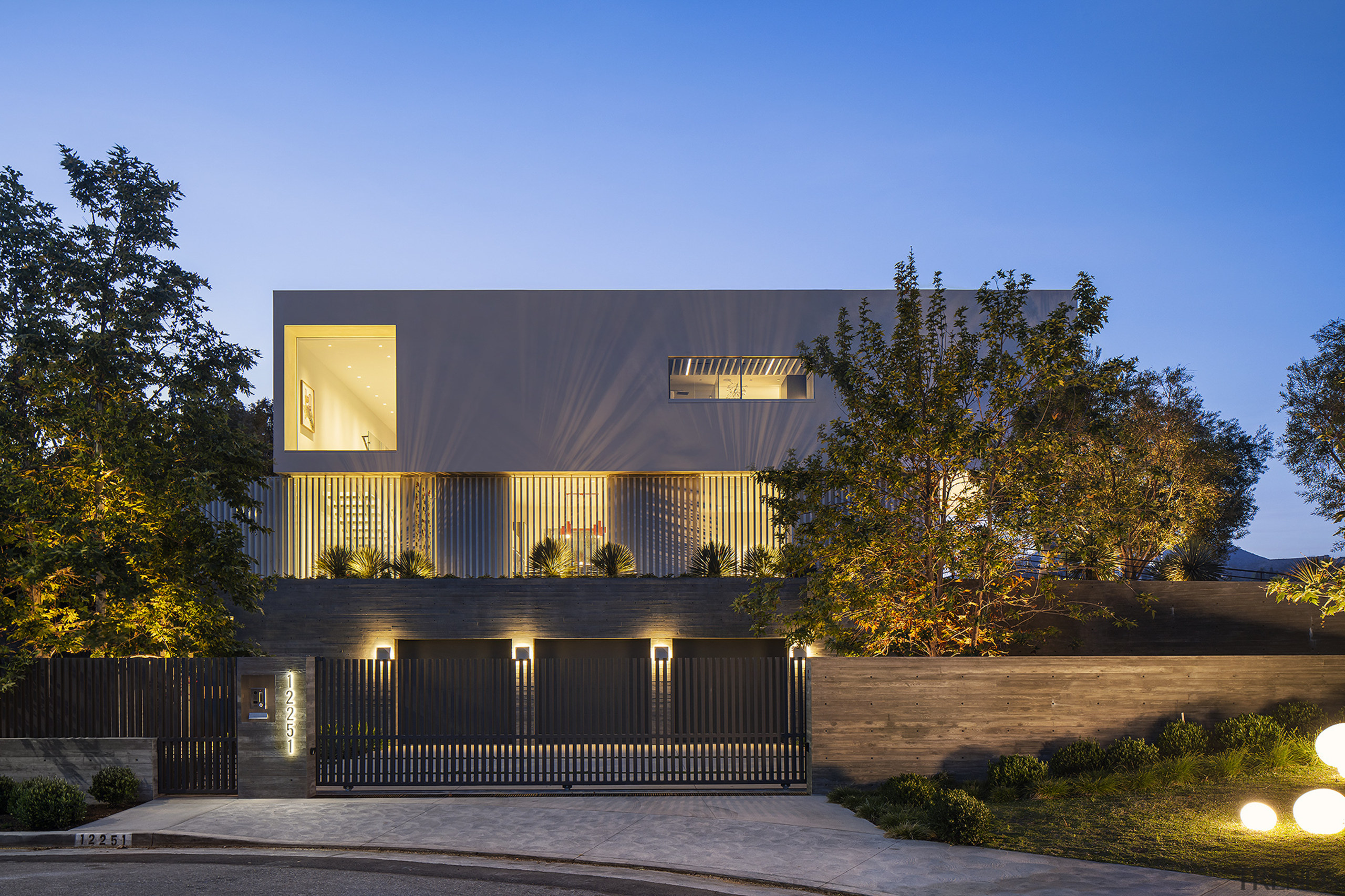 The dramatic home seen at night. - Embracing 