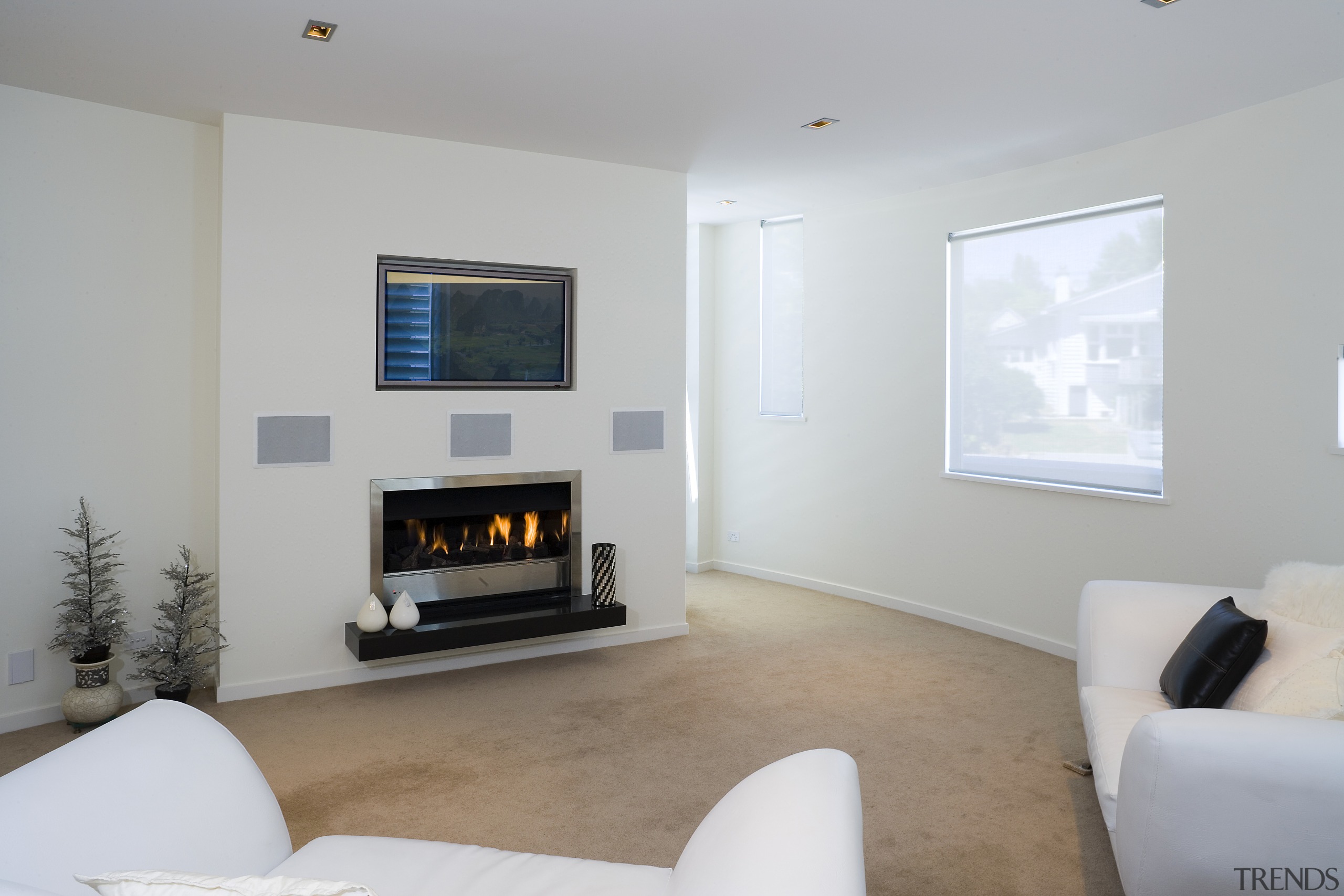 A view of the main home theatre system fireplace, floor, flooring, hearth, home, interior design, living room, property, real estate, room, gray