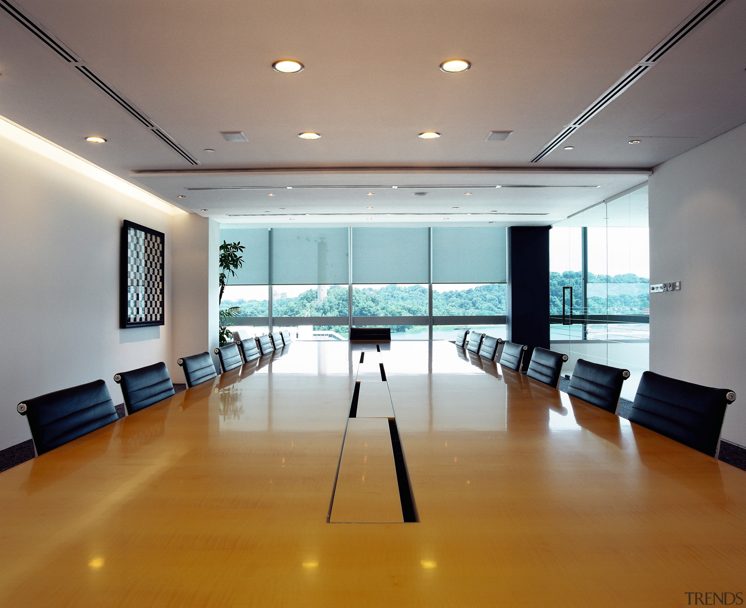 Office boardroom with large wood table and black ceiling, conference hall, daylighting, floor, flooring, interior design, real estate, table, gray, brown