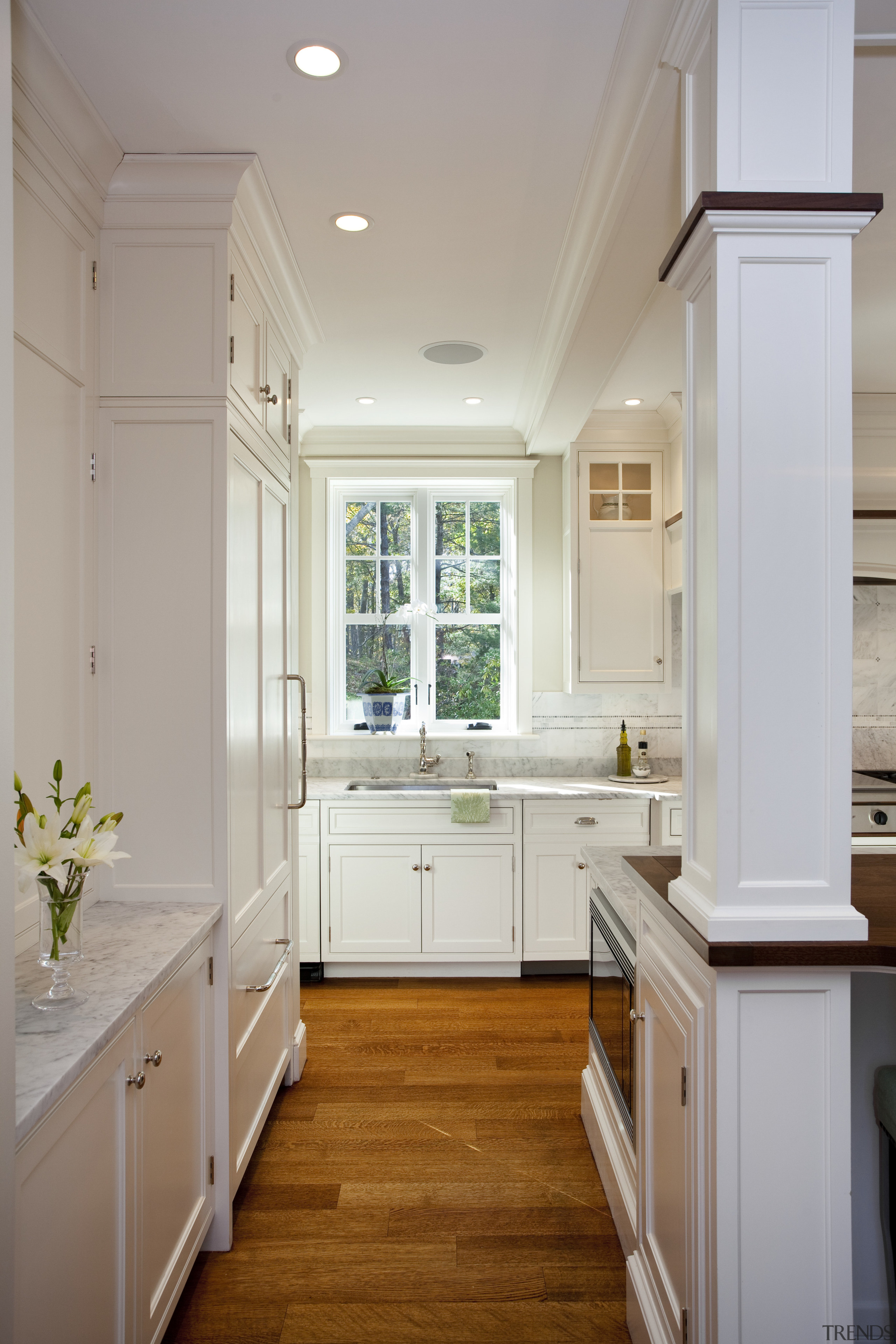 View of kitchen with white cabinetry and wooden bathroom, cabinetry, ceiling, countertop, floor, flooring, hardwood, home, interior design, kitchen, real estate, room, sink, window, wood flooring, gray