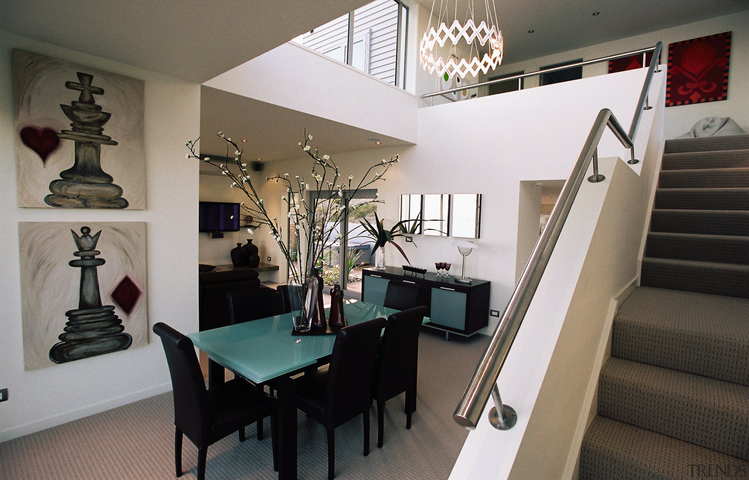 View of dining room with double height ceiling, ceiling, dining room, interior design, living room, property, real estate, room, gray, black