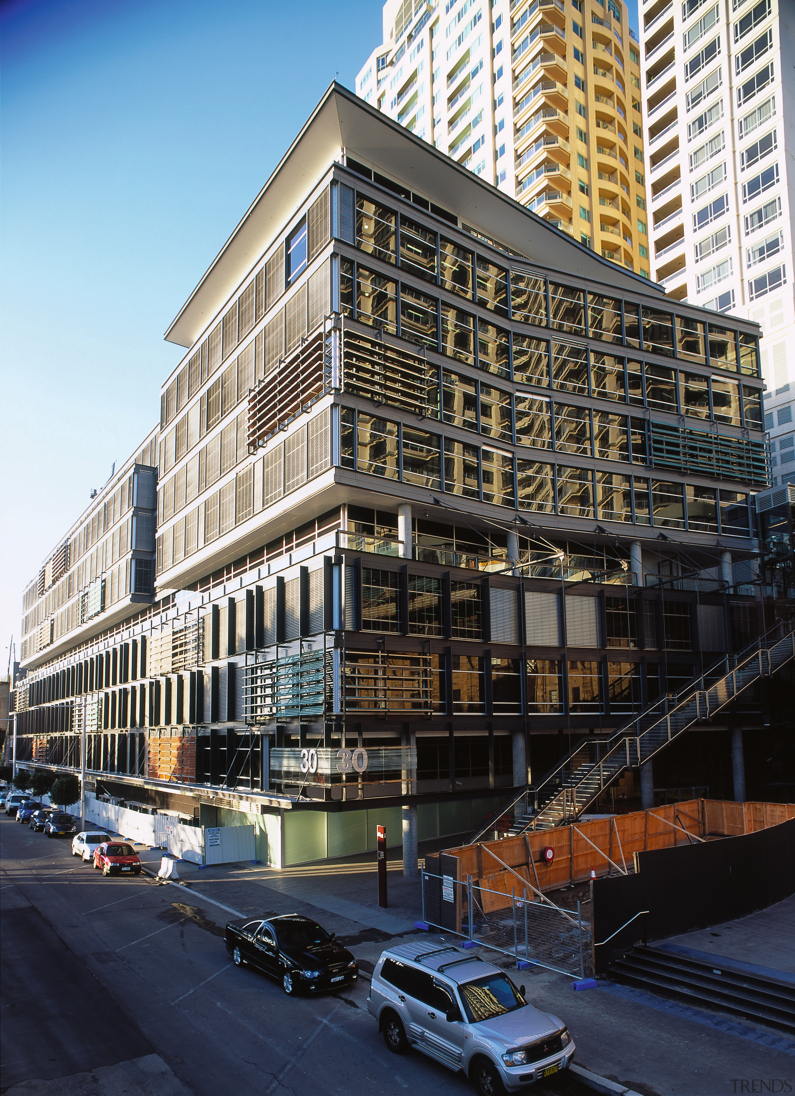 Exterior view of the 30 The Bond office apartment, architecture, building, city, commercial building, condominium, corporate headquarters, daytime, downtown, facade, headquarters, house, landmark, metropolis, metropolitan area, mixed use, neighbourhood, real estate, reflection, residential area, sky, skyscraper, tower block, urban area, window, black