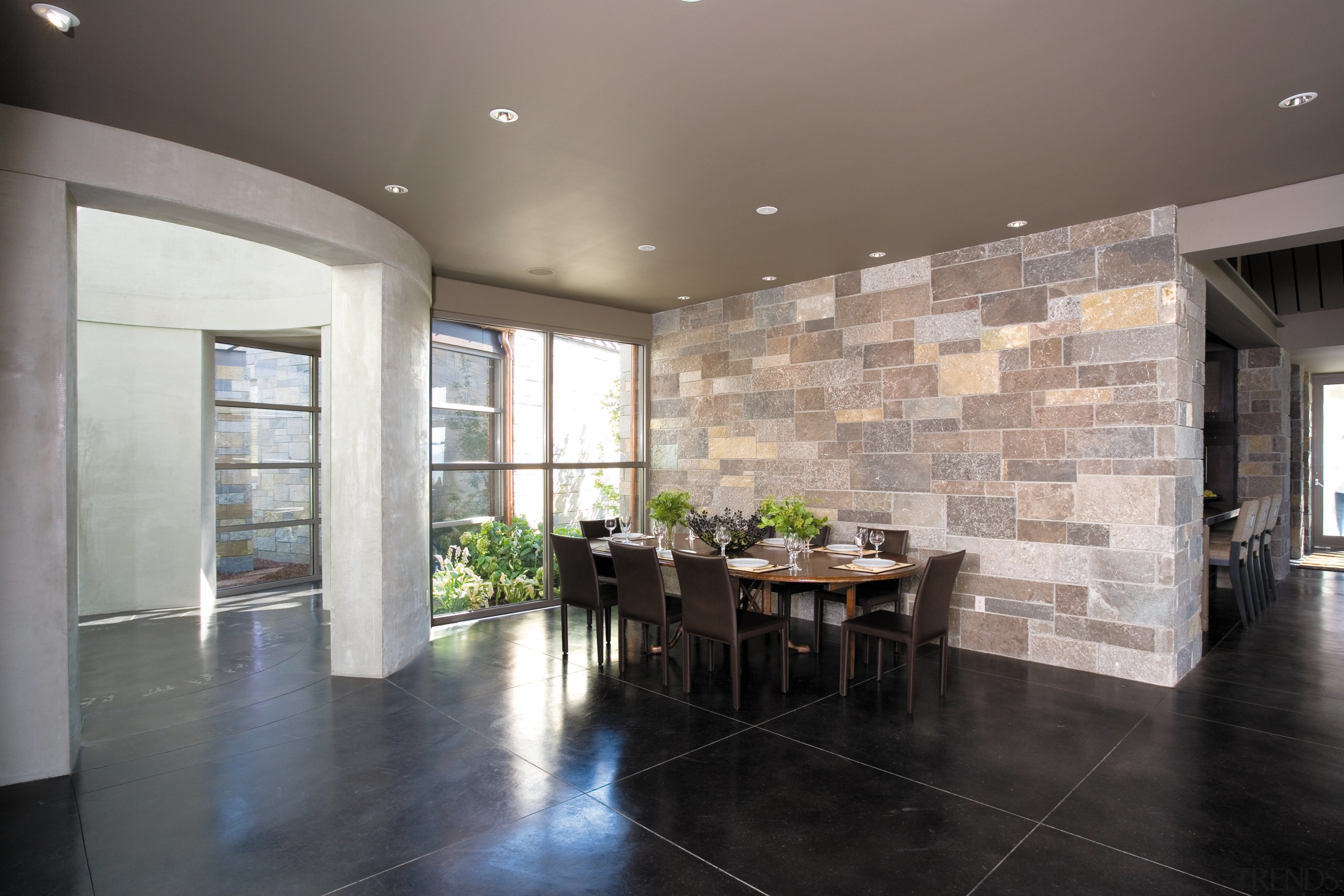 A view of the dining area, concrete flooring, architecture, ceiling, daylighting, estate, floor, flooring, house, interior design, living room, lobby, property, real estate, room, tile, wall, wood flooring, gray