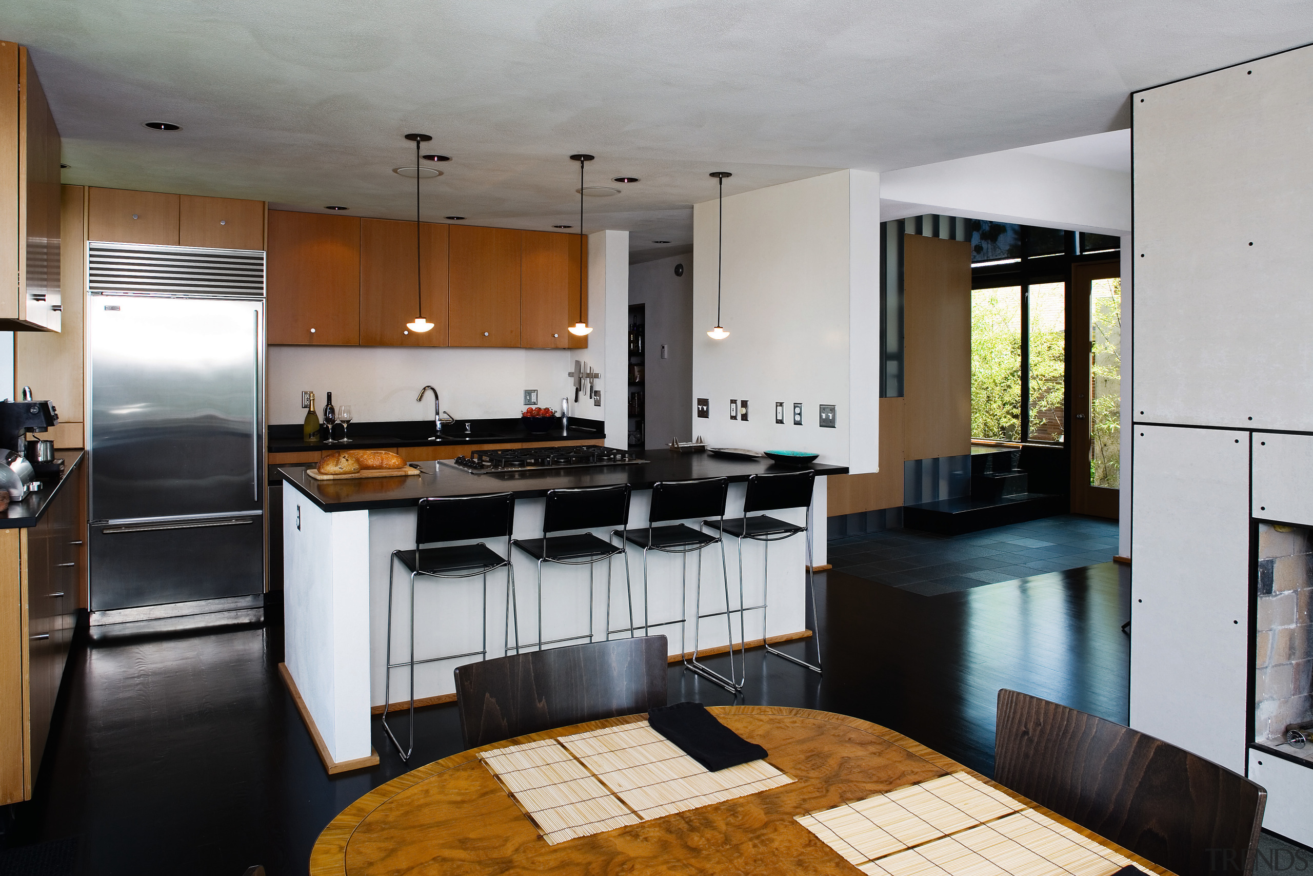 view of the kitchen featuring stainlees steel sink/kitchen cabinetry, countertop, cuisine classique, interior design, kitchen, real estate, room, gray, black