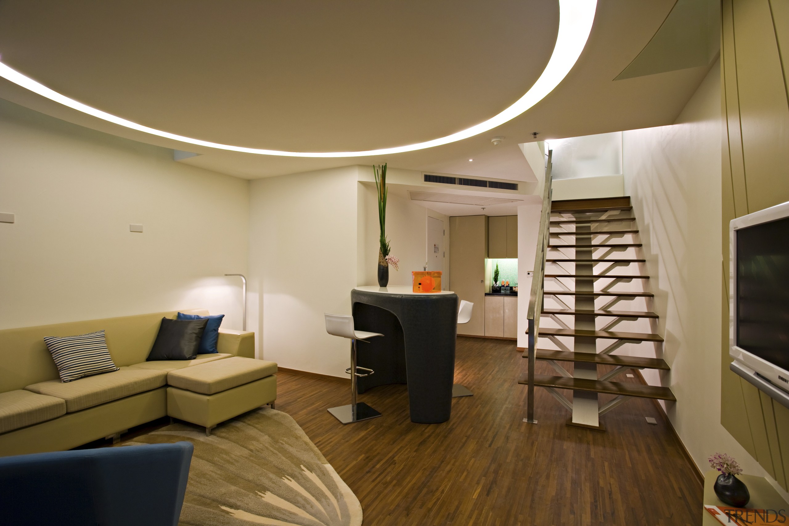 View of a two story hotel suite featuring ceiling, interior design, living room, room, brown