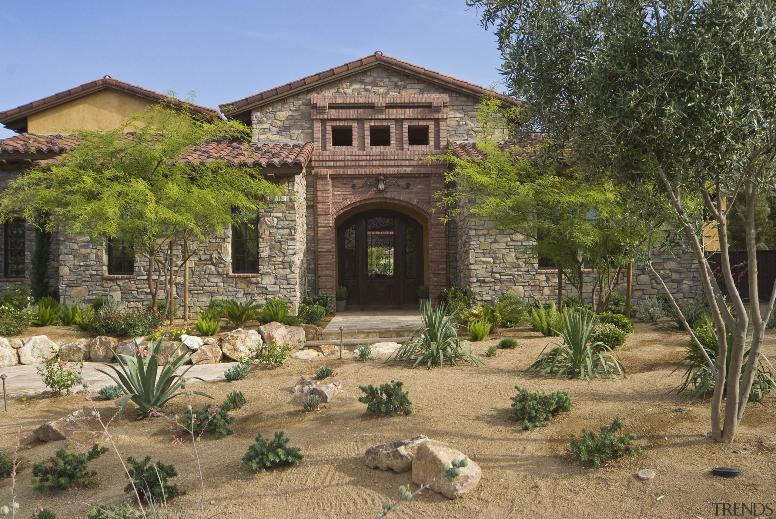 Exterior view of residence which was built by estate, home, house, landscape, landscaping, plant, property, real estate, tree, brown