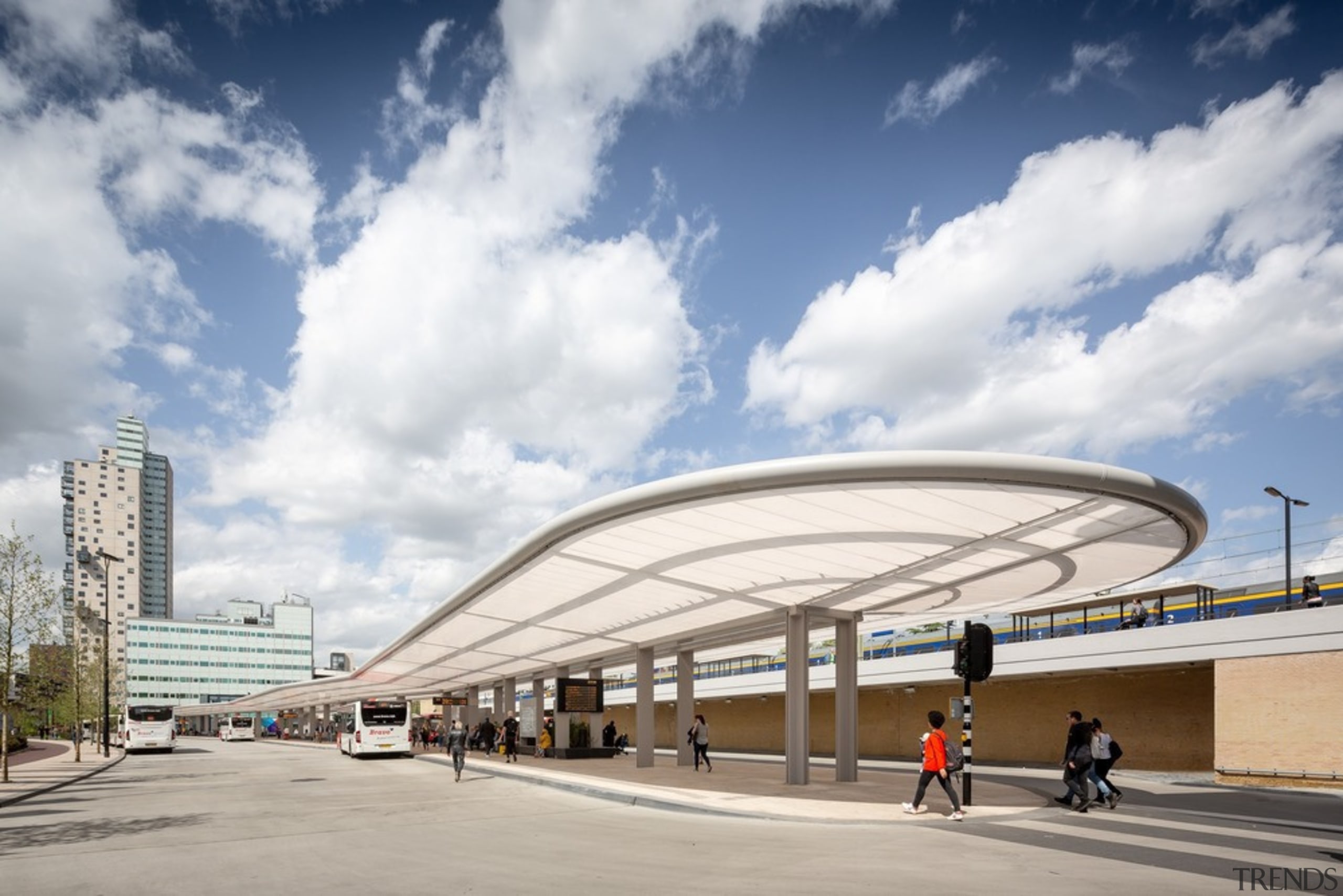 The new bus station is a part of architecture, building, city, commercial building, metropolitan area, mixed-use, sky, transport, white, gray