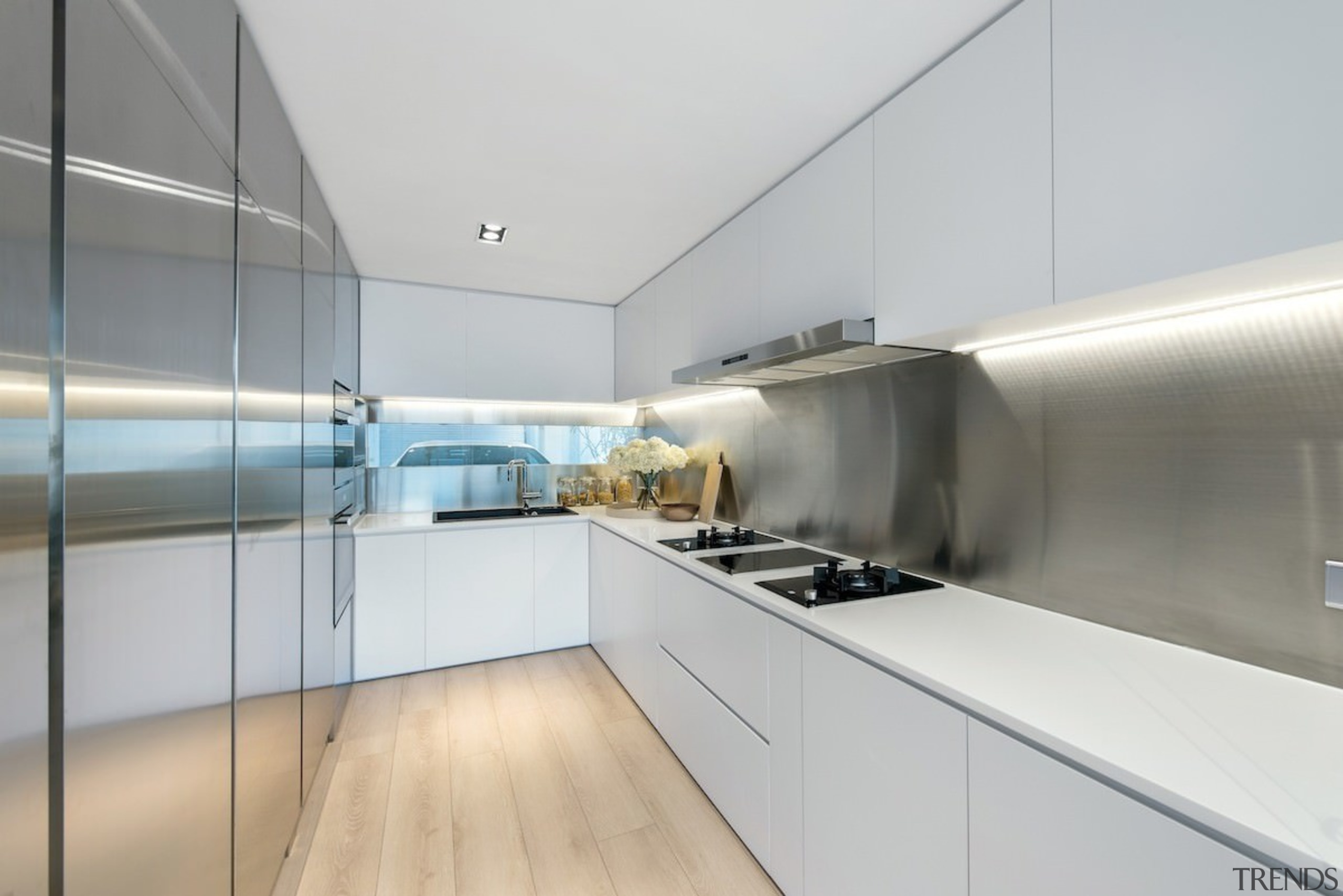 Recessed lighting rings this kitchen, while a window architecture, countertop, interior design, kitchen, product design, real estate, gray