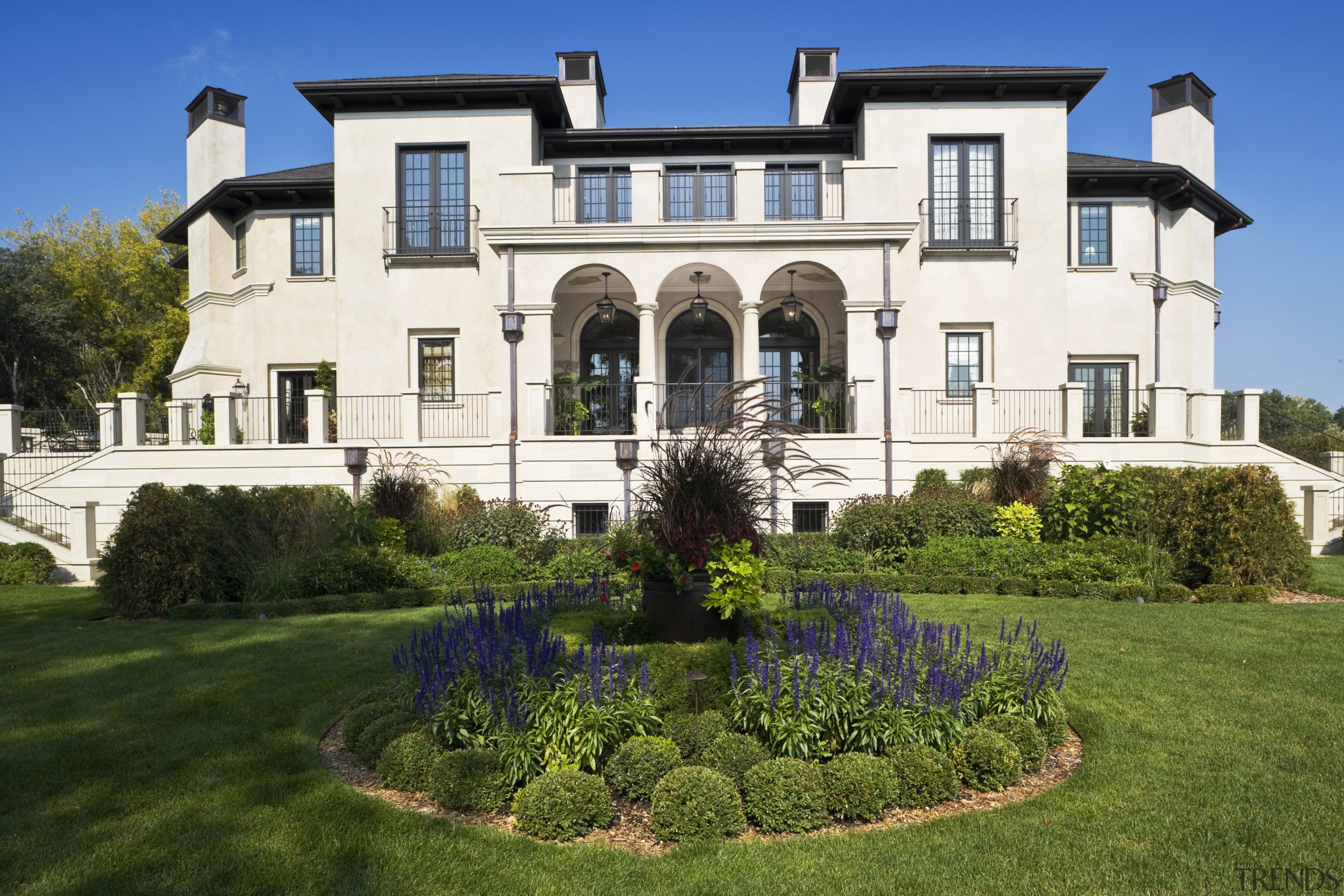 Exterior view of Renaissance styled home with stucco building, cottage, estate, facade, historic house, home, house, landscaping, lawn, mansion, property, real estate, residential area, villa, brown