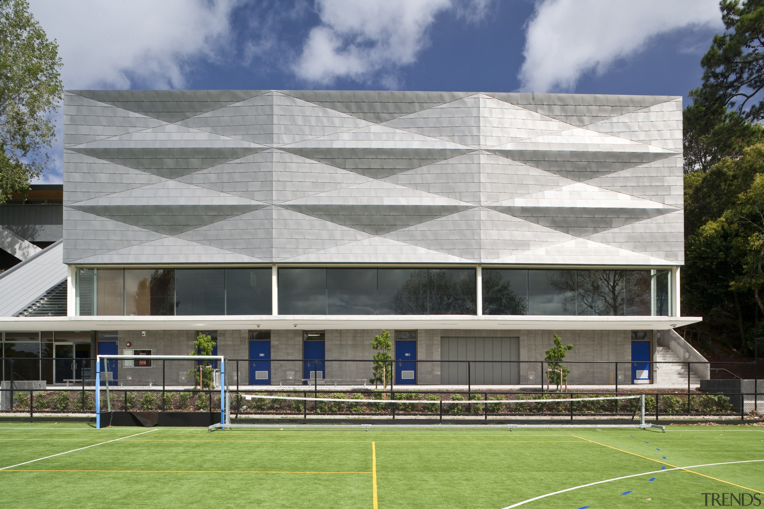 Exterior view of the St Kents' Jubilee Sports architecture, building, corporate headquarters, daylighting, daytime, elevation, facade, grass, headquarters, house, real estate, roof, sky, sport venue, structure, window, gray