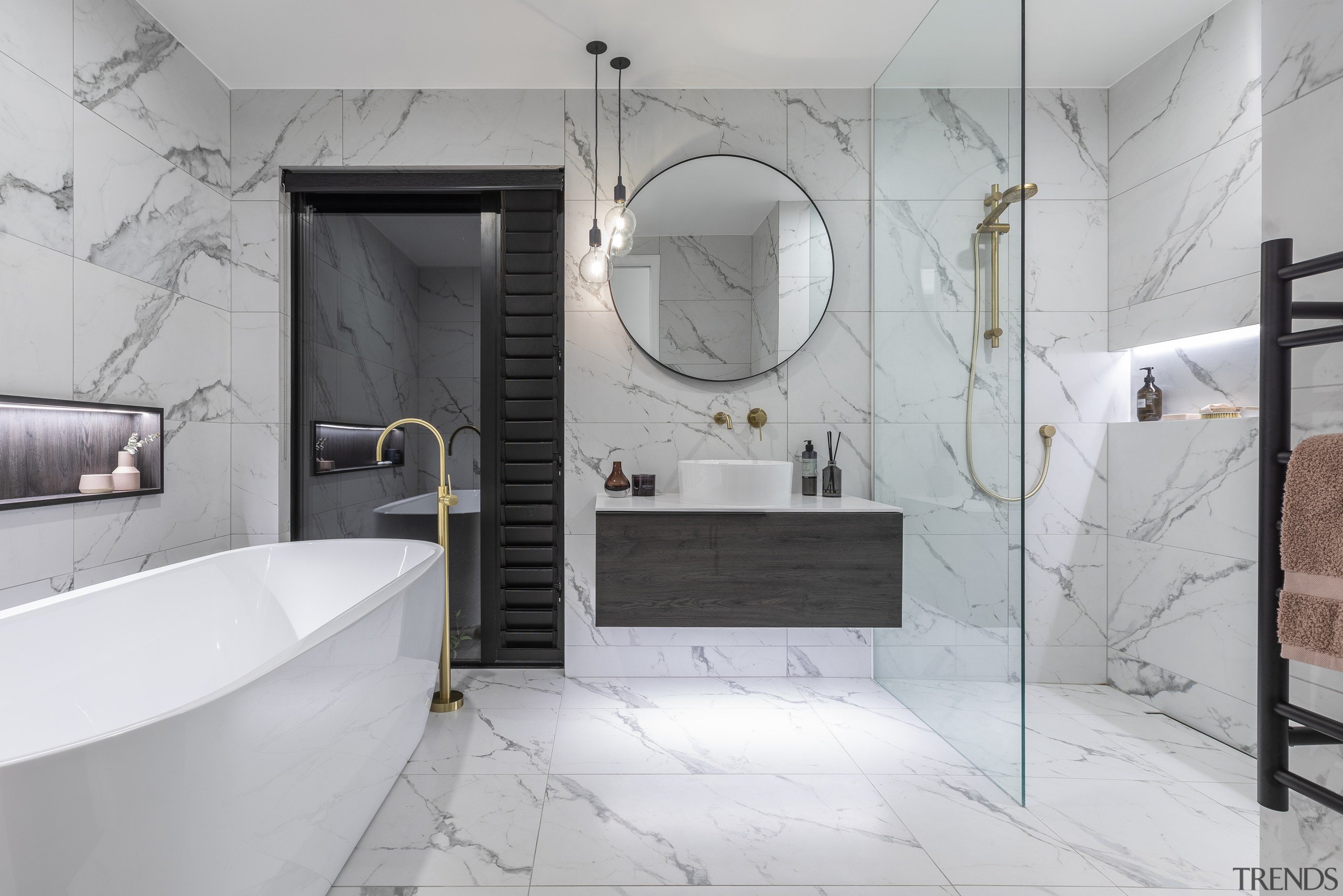 A large shower zone and freestanding bath make 