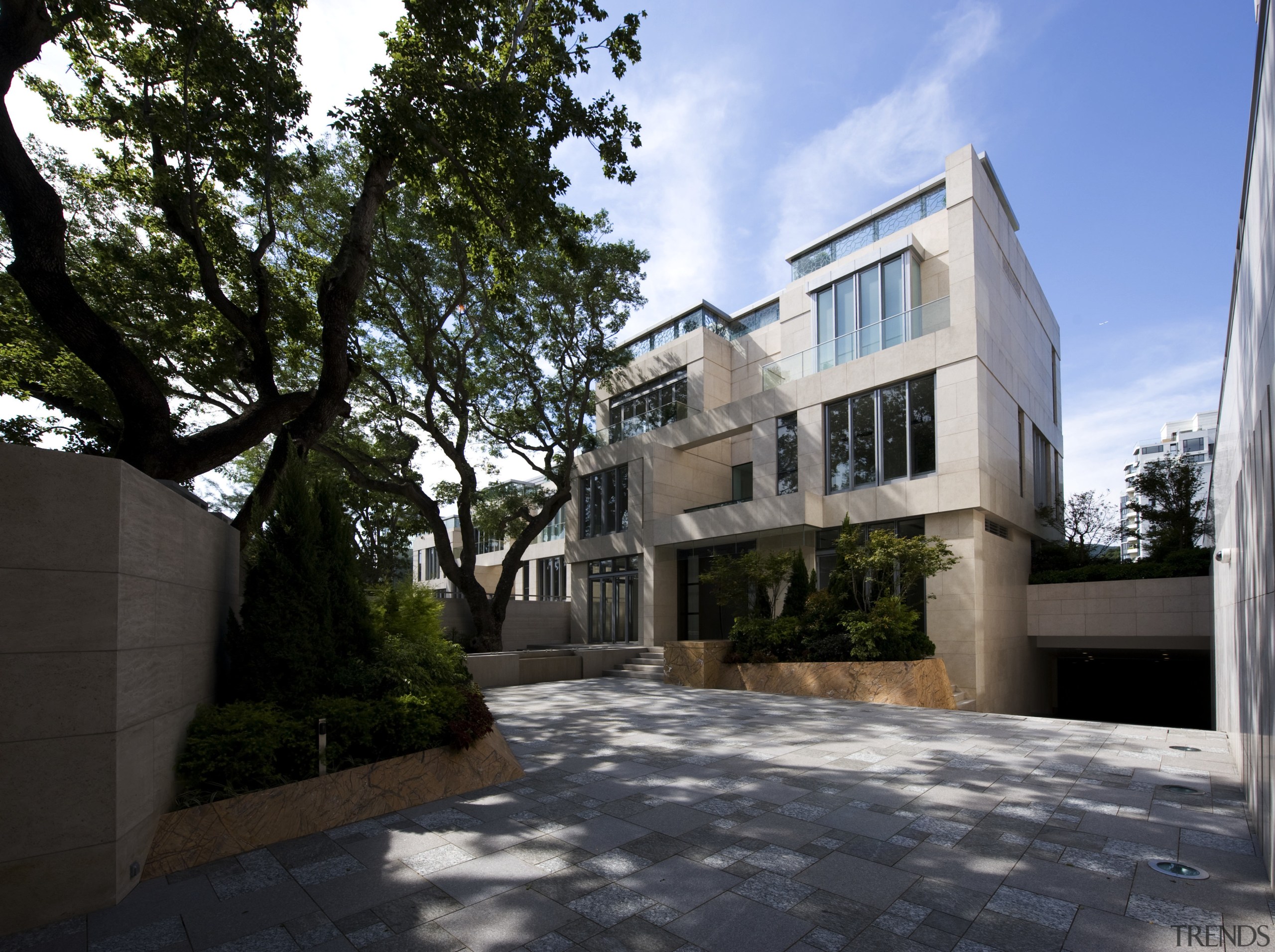 Exterior view of contemporary home. - Exterior view apartment, architecture, building, condominium, courtyard, estate, facade, home, house, mansion, neighbourhood, property, real estate, residential area, tree, walkway, black