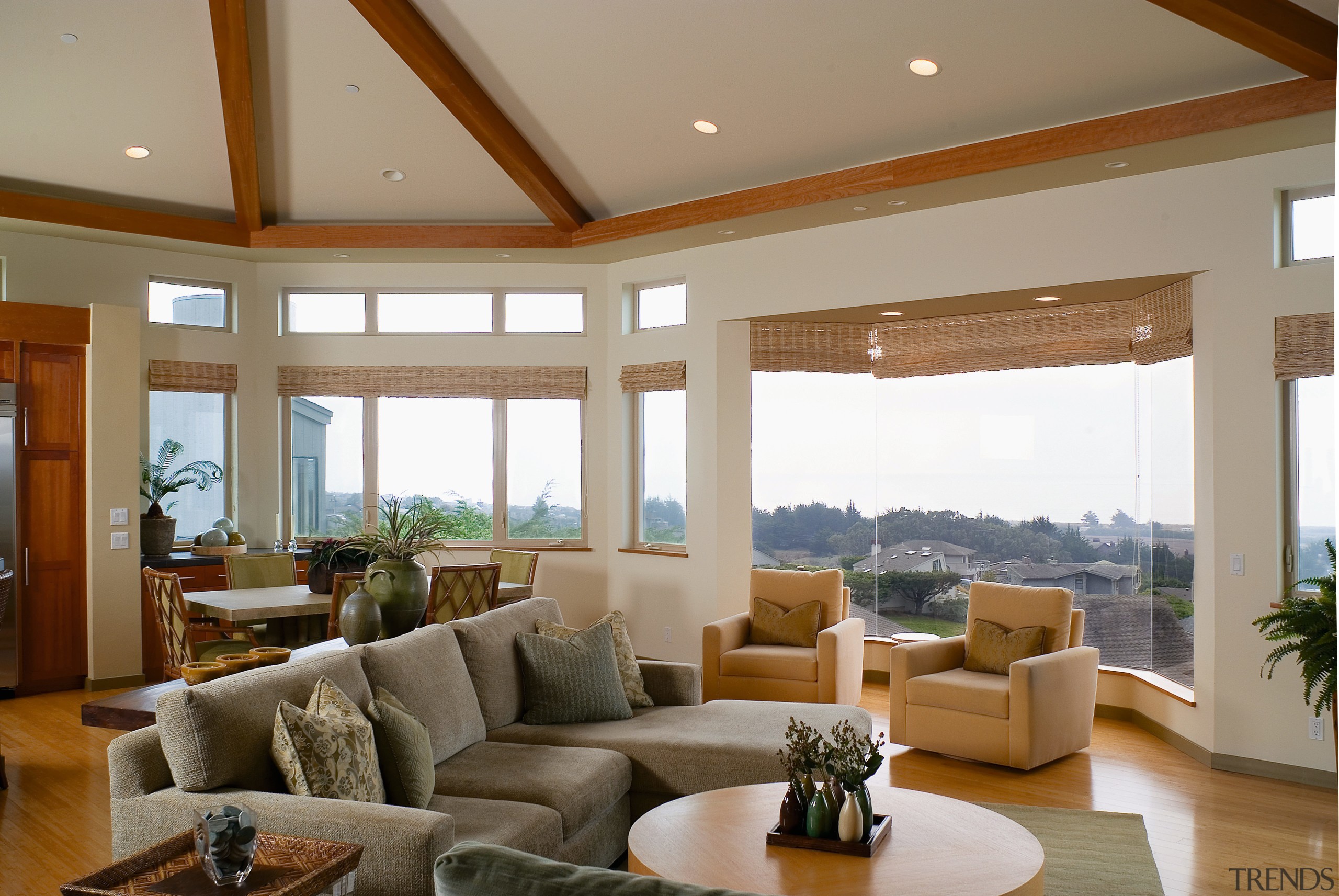 View of open plan living area with large ceiling, daylighting, estate, hardwood, home, interior design, living room, property, real estate, room, window, brown, gray