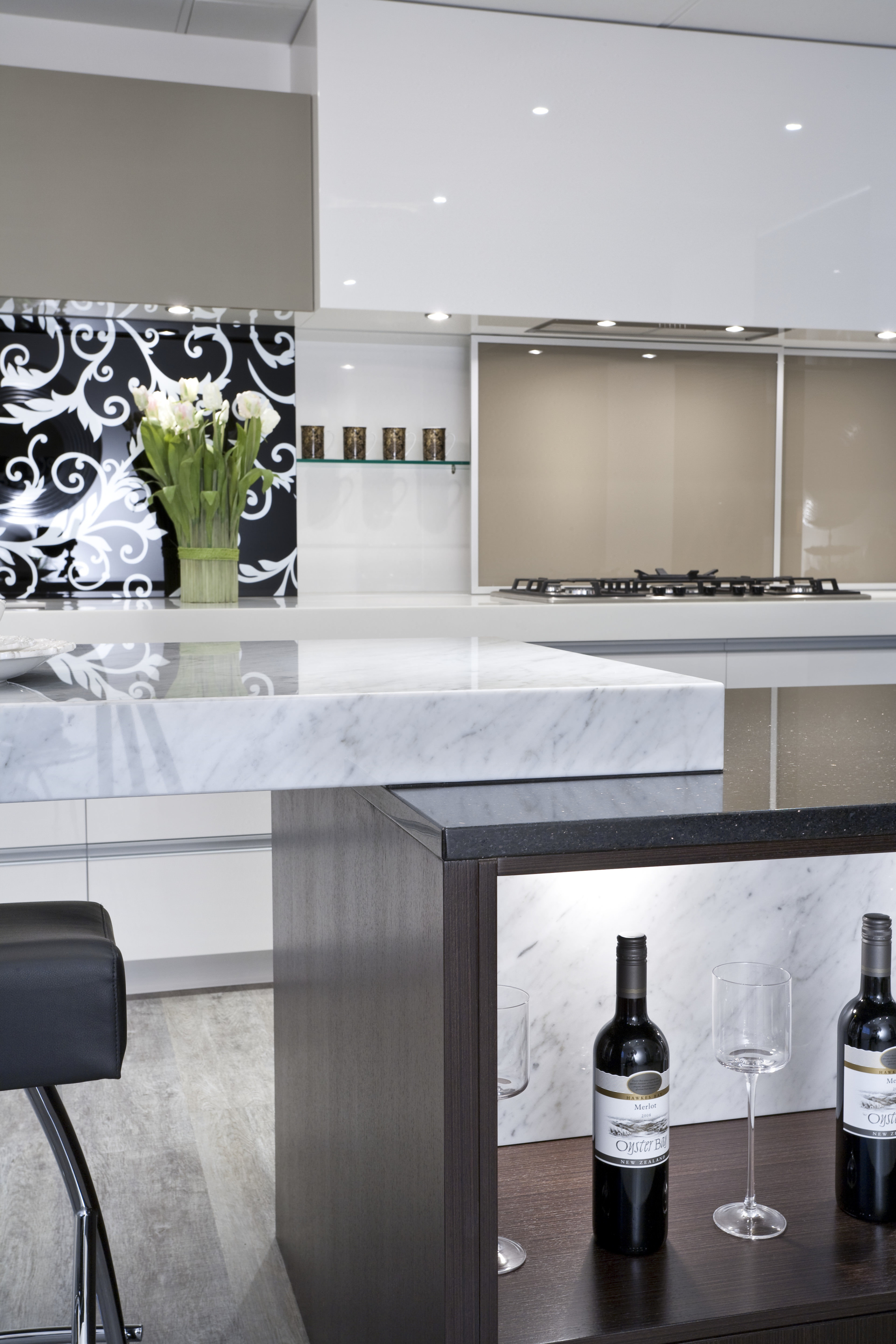 This kitchen by Yellowfox features an island with countertop, floor, flooring, furniture, interior design, kitchen, product design, table, gray