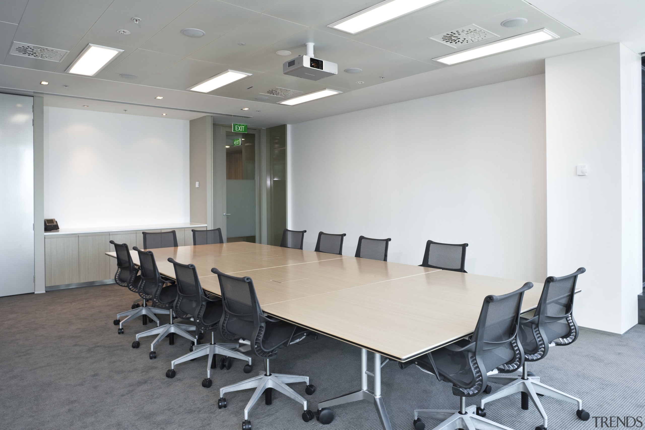 View of contemporary boardroom table from Wilkhan Pacific. ceiling, conference hall, floor, furniture, interior design, office, table, gray, white