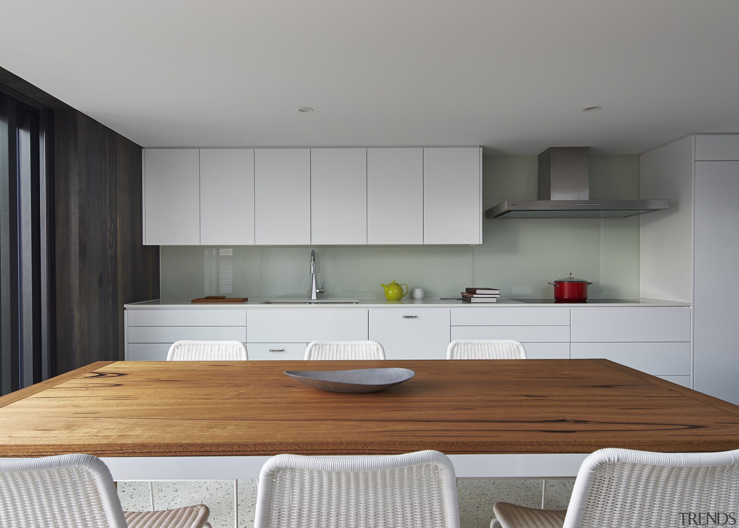 The perimeter kitchen is positioned a few steps architecture, countertop, interior design, kitchen, product design, room, gray