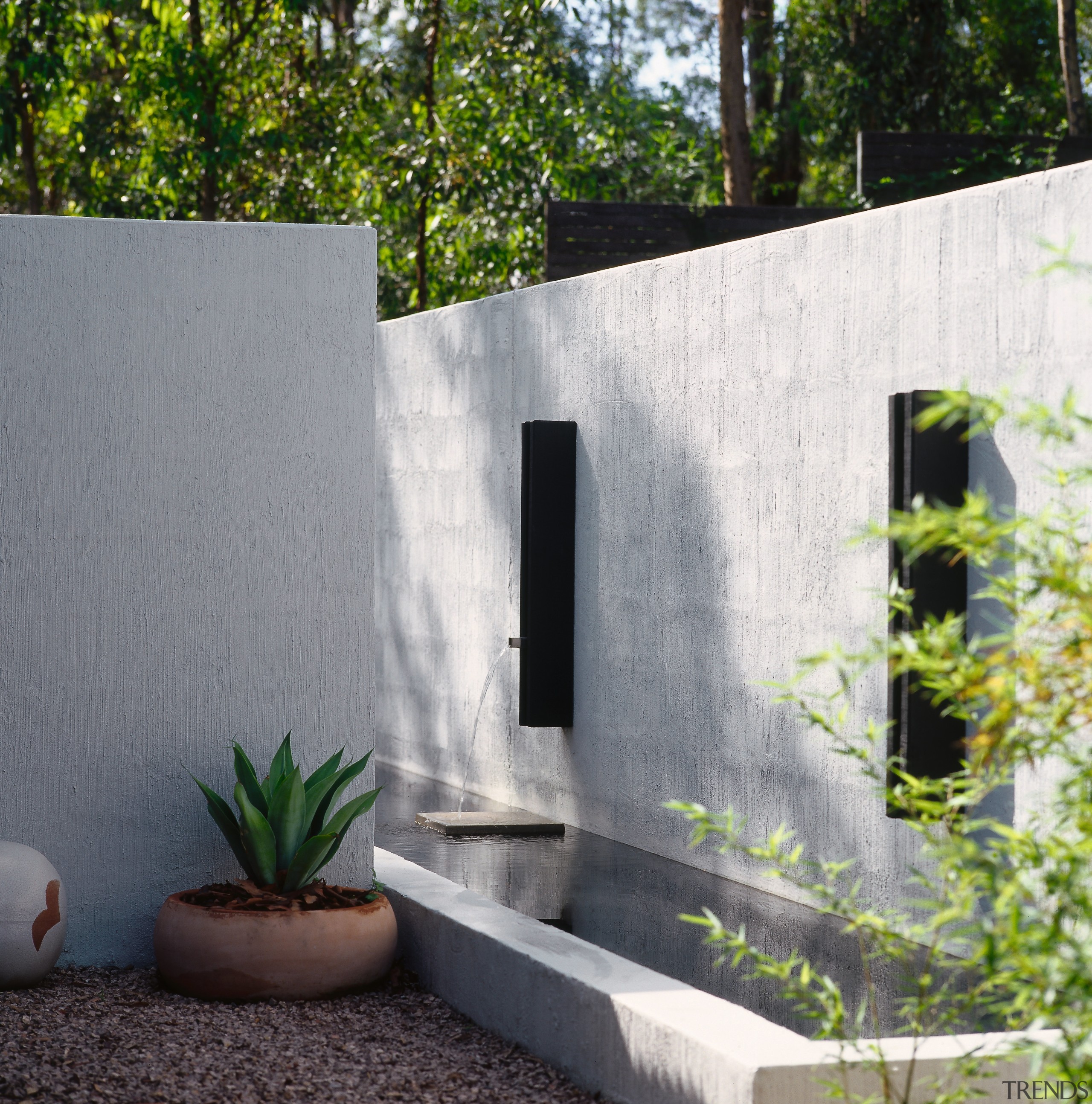 View of the water feature along side and architecture, backyard, courtyard, house, wall, yard, gray