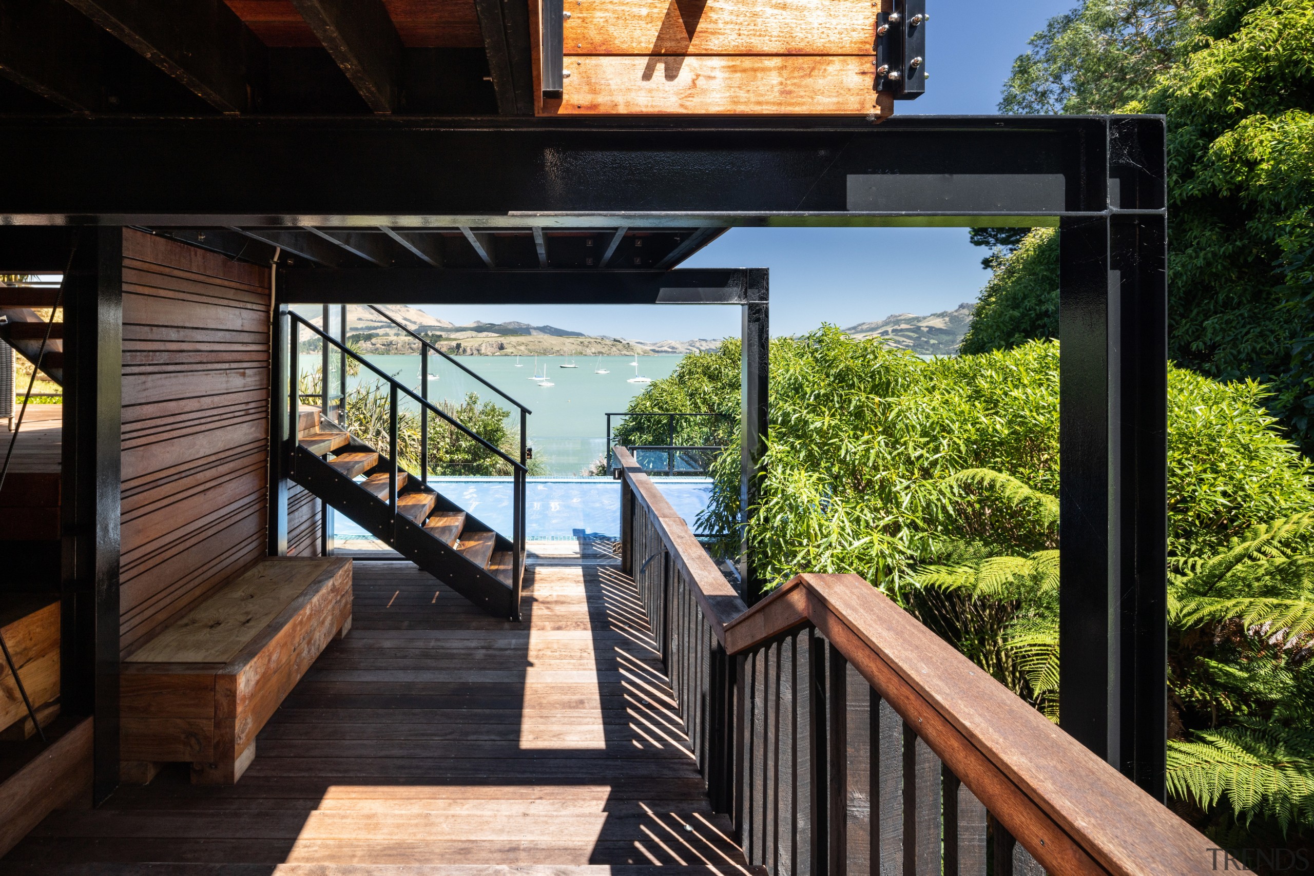 Beneath the terraced outdoor living area. - Through 