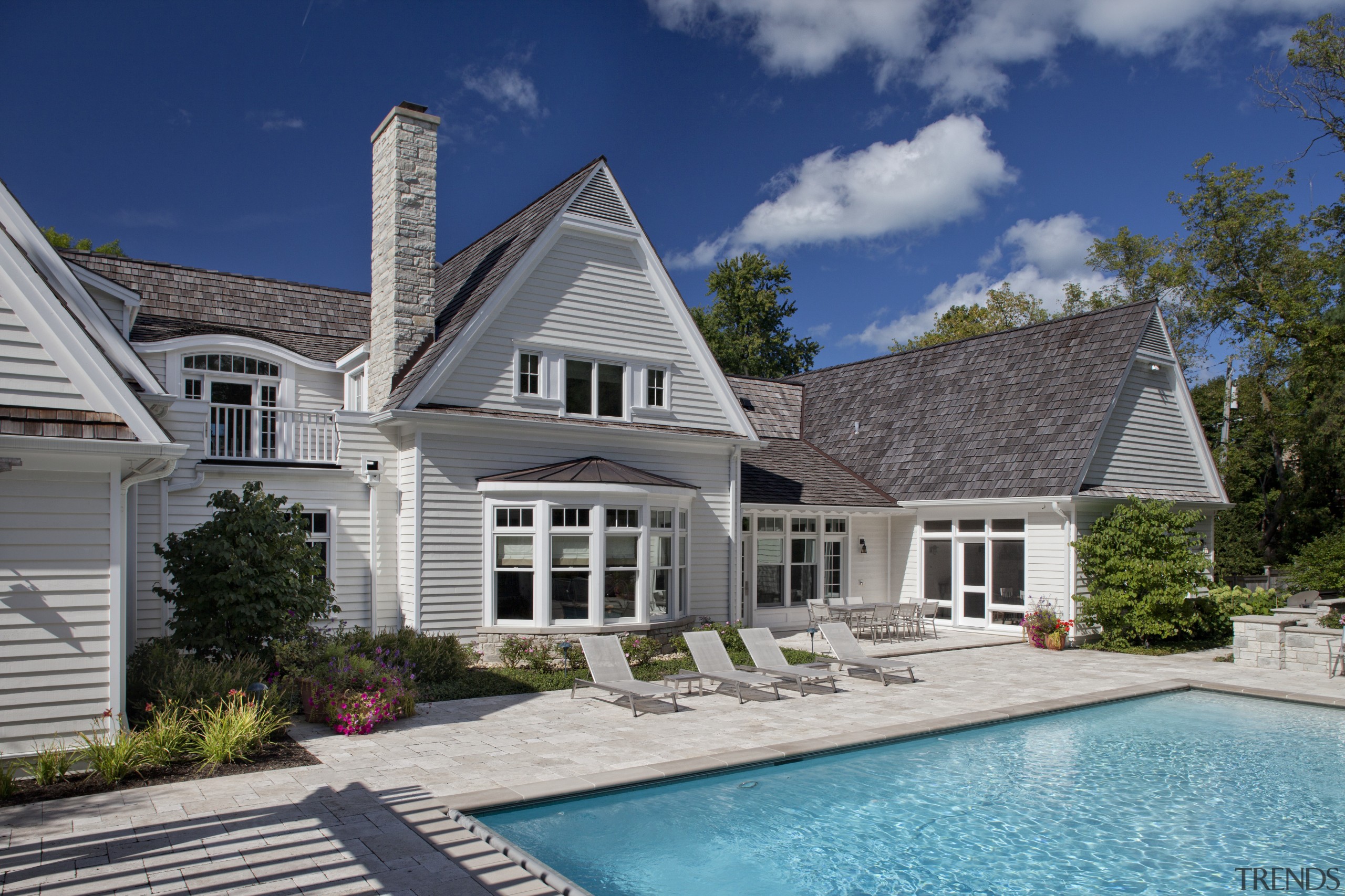 Exterior view of home with pool area. - backyard, cottage, elevation, estate, facade, farmhouse, home, house, mansion, outdoor structure, property, real estate, residential area, roof, siding, swimming pool, villa, window, gray, blue