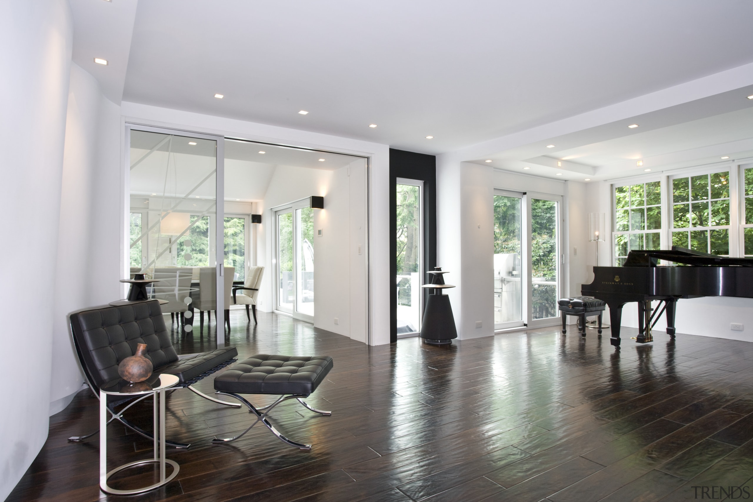 A shot of the white painted contemporary minimalist ceiling, floor, flooring, hardwood, home, interior design, laminate flooring, living room, property, real estate, room, wood flooring, gray, white