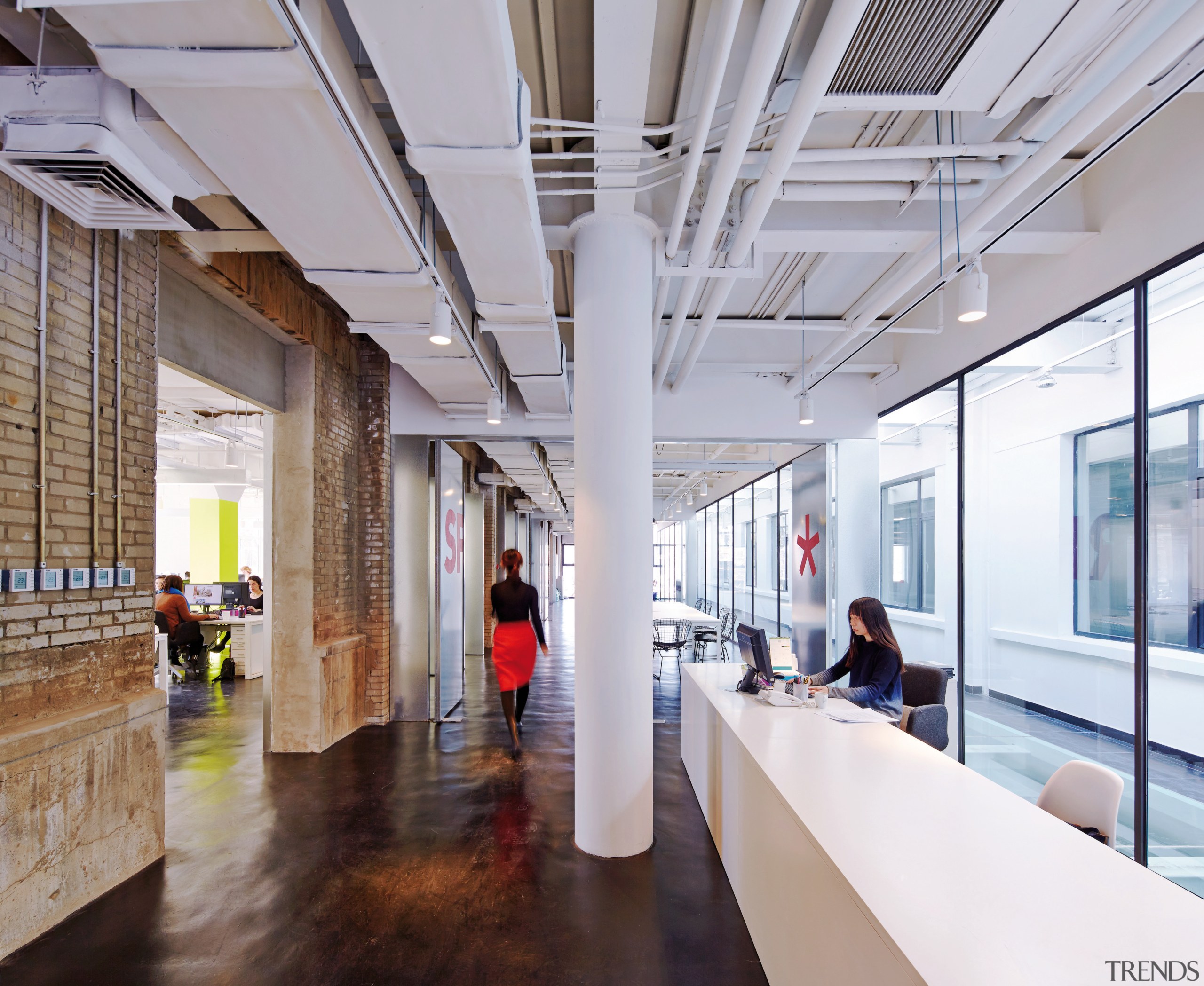 Exposed brick walls and service ducts provide an architecture, ceiling, interior design, lobby, gray