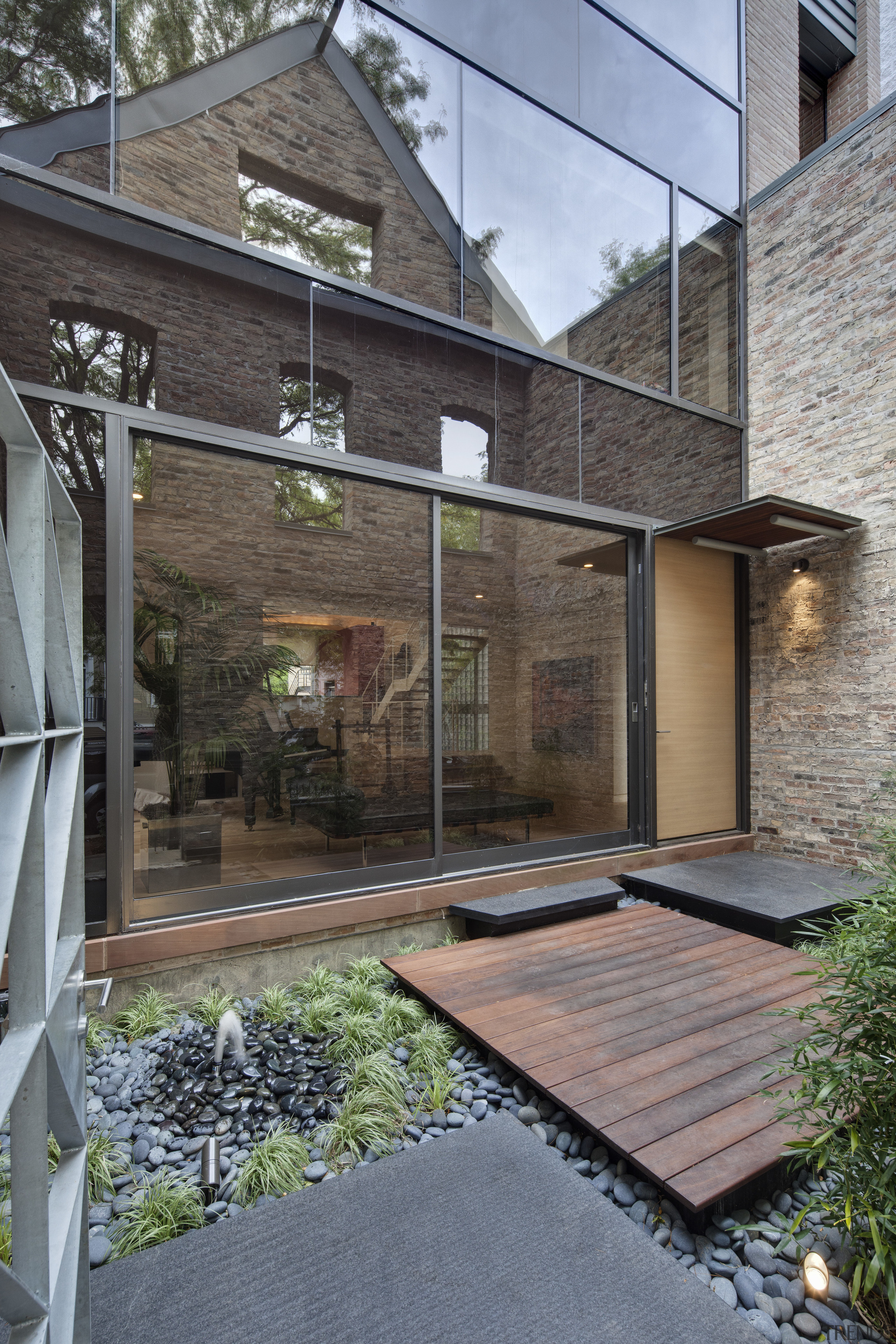 View of a renovated three-story home, built to architecture, courtyard, facade, home, house, outdoor structure, real estate, residential area, siding, gray