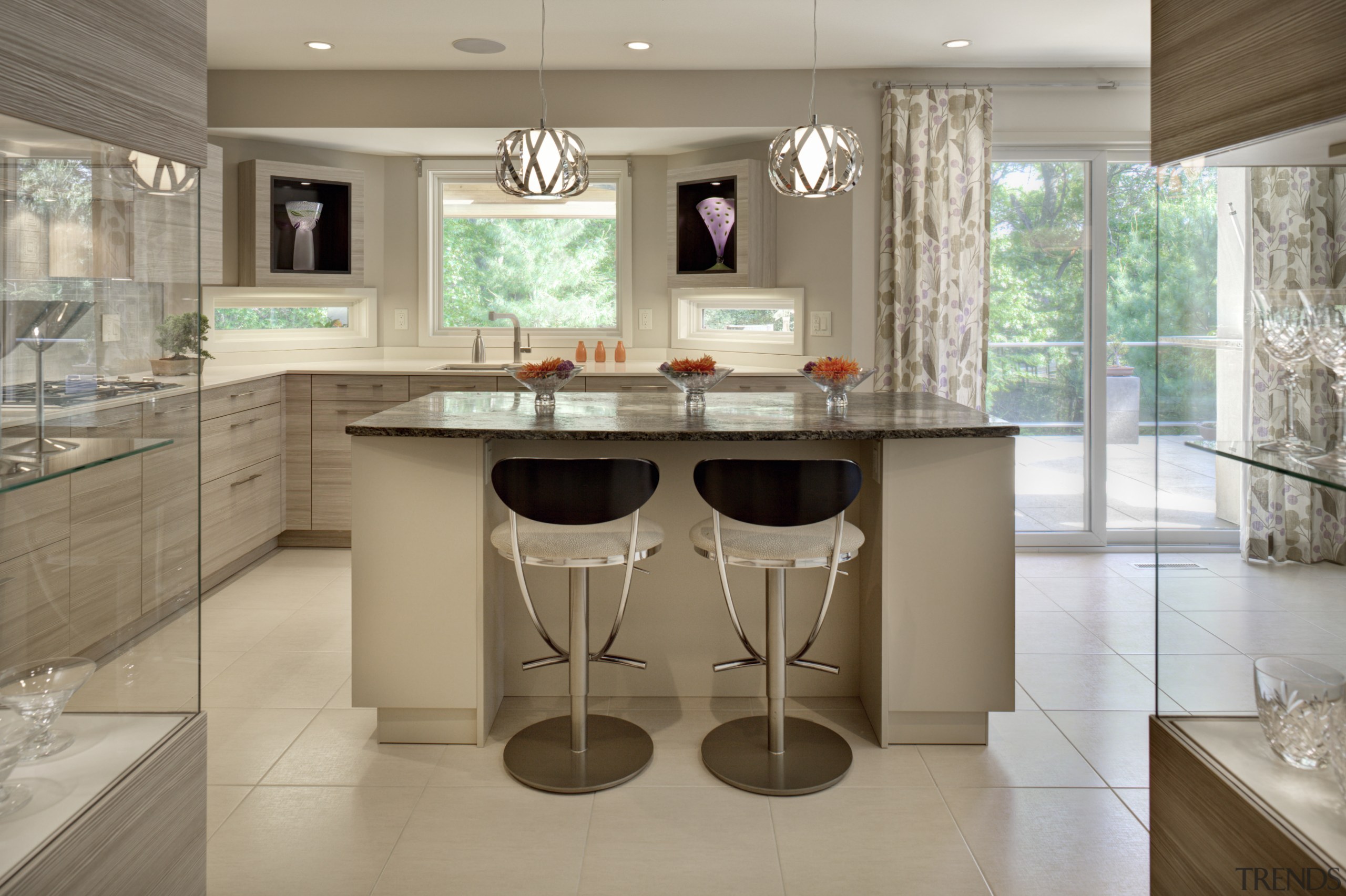 An angled exterior wall on this new kitchen, cabinetry, countertop, cuisine classique, floor, interior design, kitchen, room, table, gray, brown