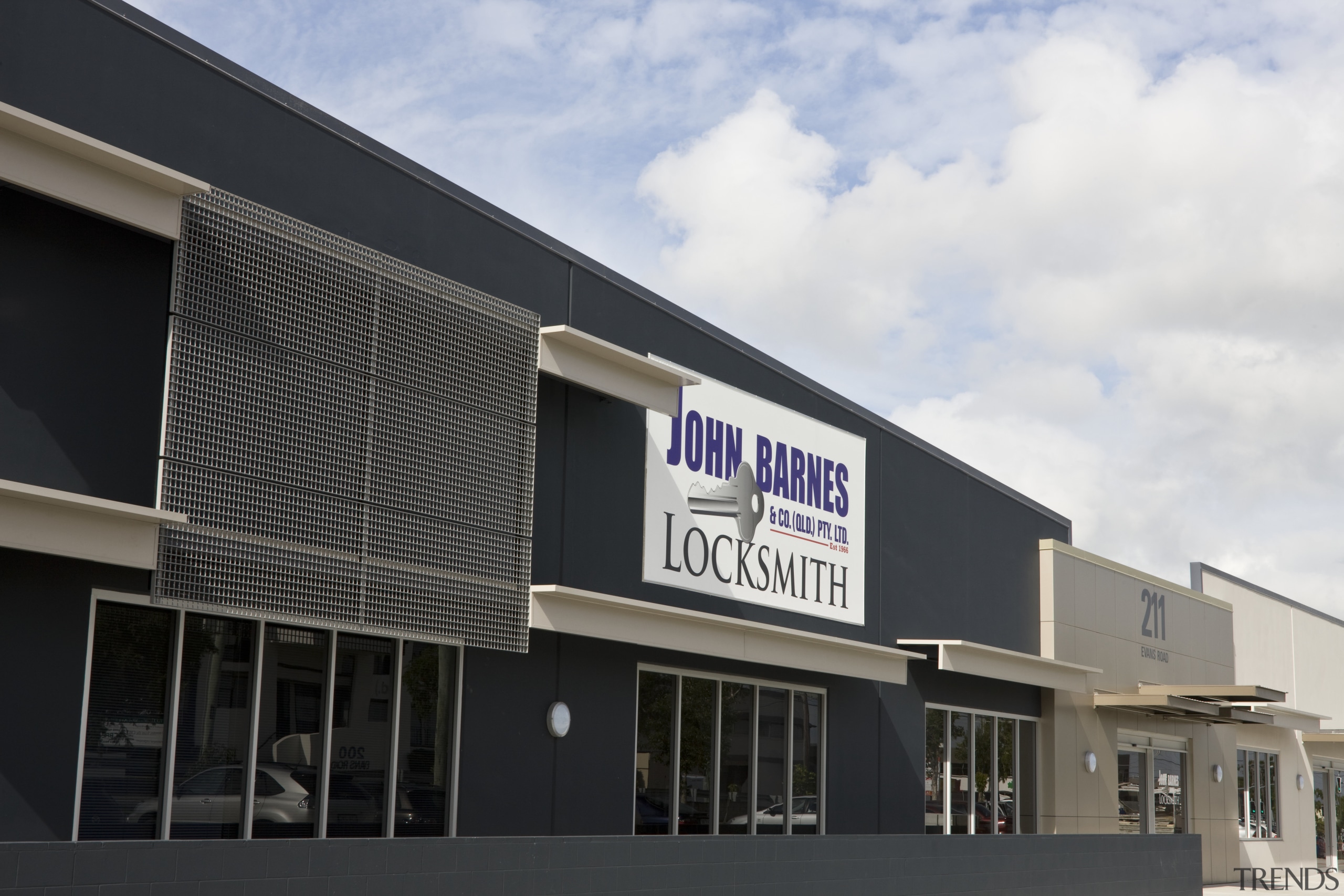 Image of John Barnes and Company. The OFS architecture, building, commercial building, corporate headquarters, facade, property, real estate, black, white