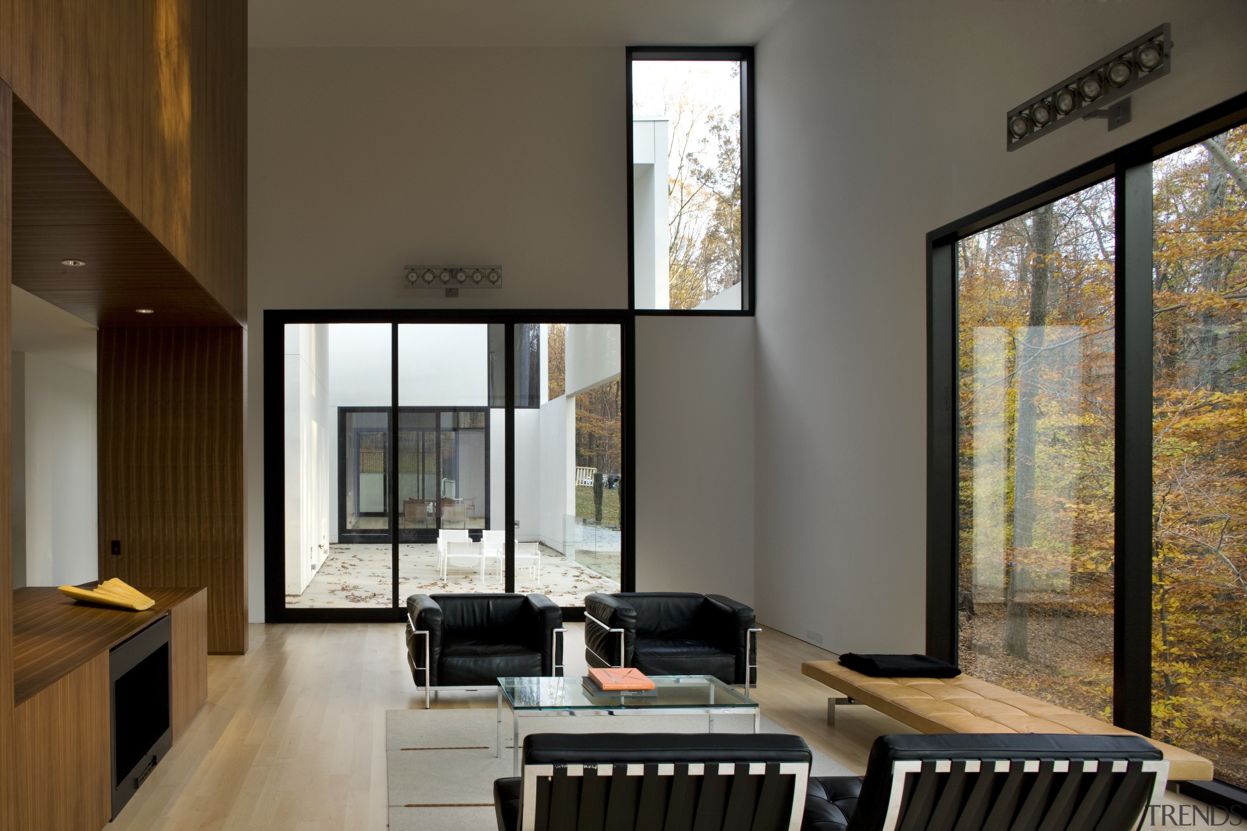 View of living area that features maple flooring, architecture, ceiling, house, interior design, living room, real estate, window, brown, gray