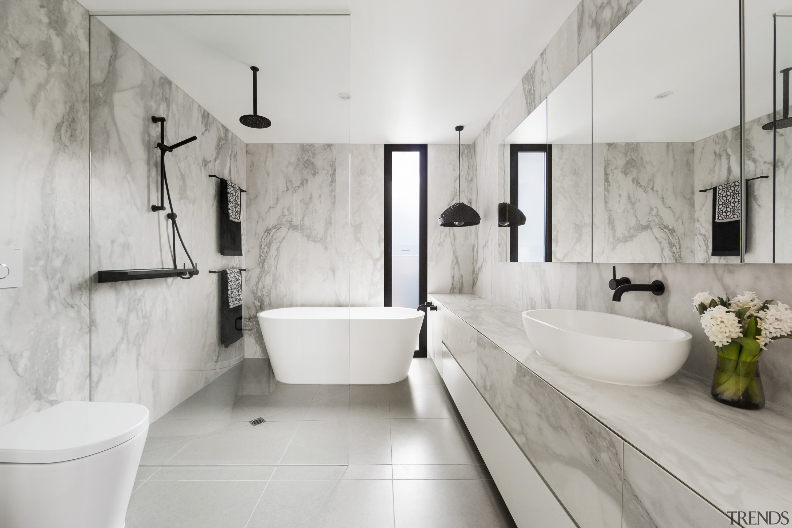 ​​​​​​​Project architect Linda Simons of LSA Architects created architecture, bathroom, tiled floor, home, bathroom design, plumbing fixture, tap, marble, freestanding bath, LSA Architects