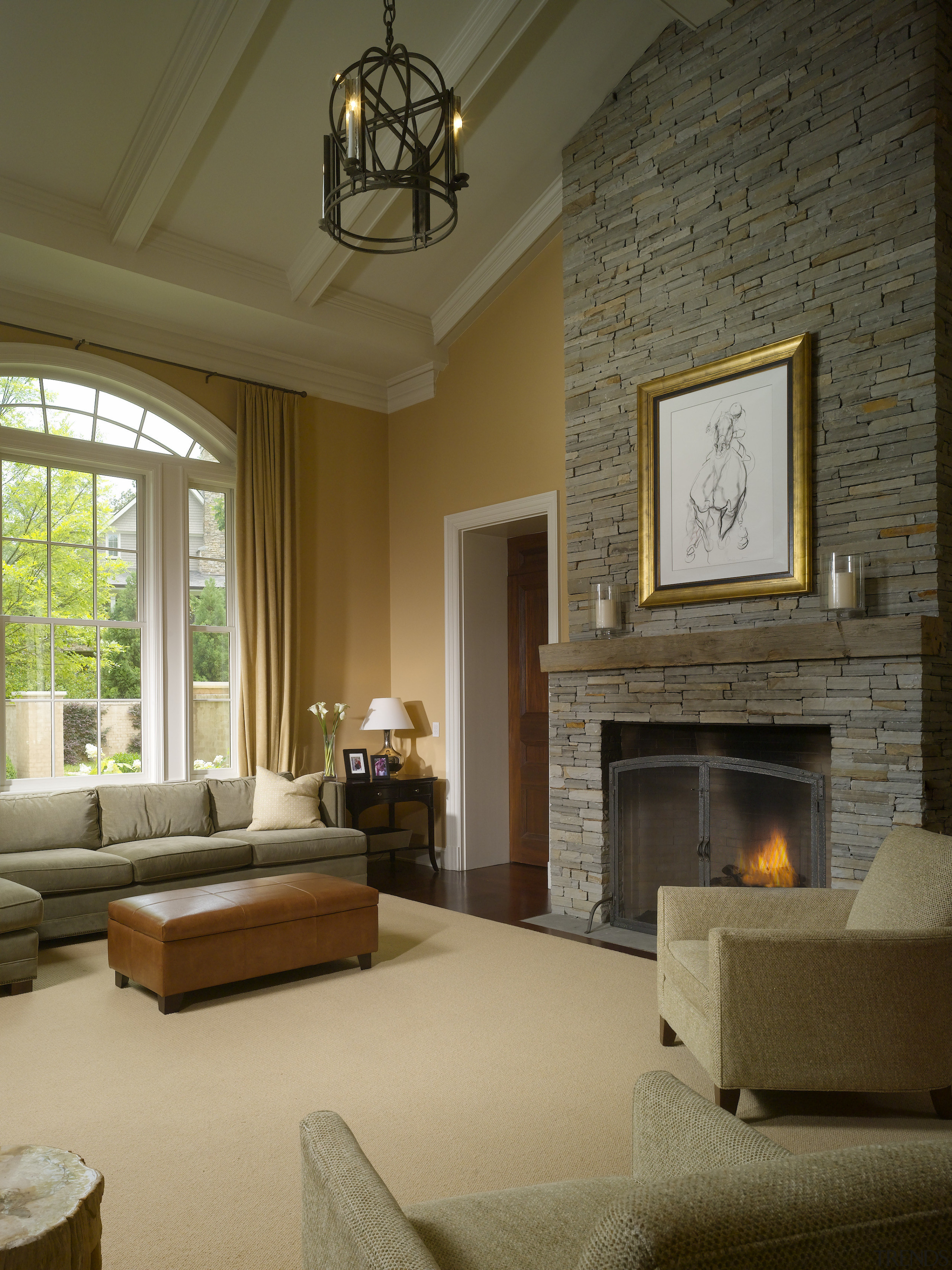 View of a living area in this Regency-styled ceiling, fireplace, floor, flooring, hearth, home, interior design, living room, room, wall, window, wood flooring, brown