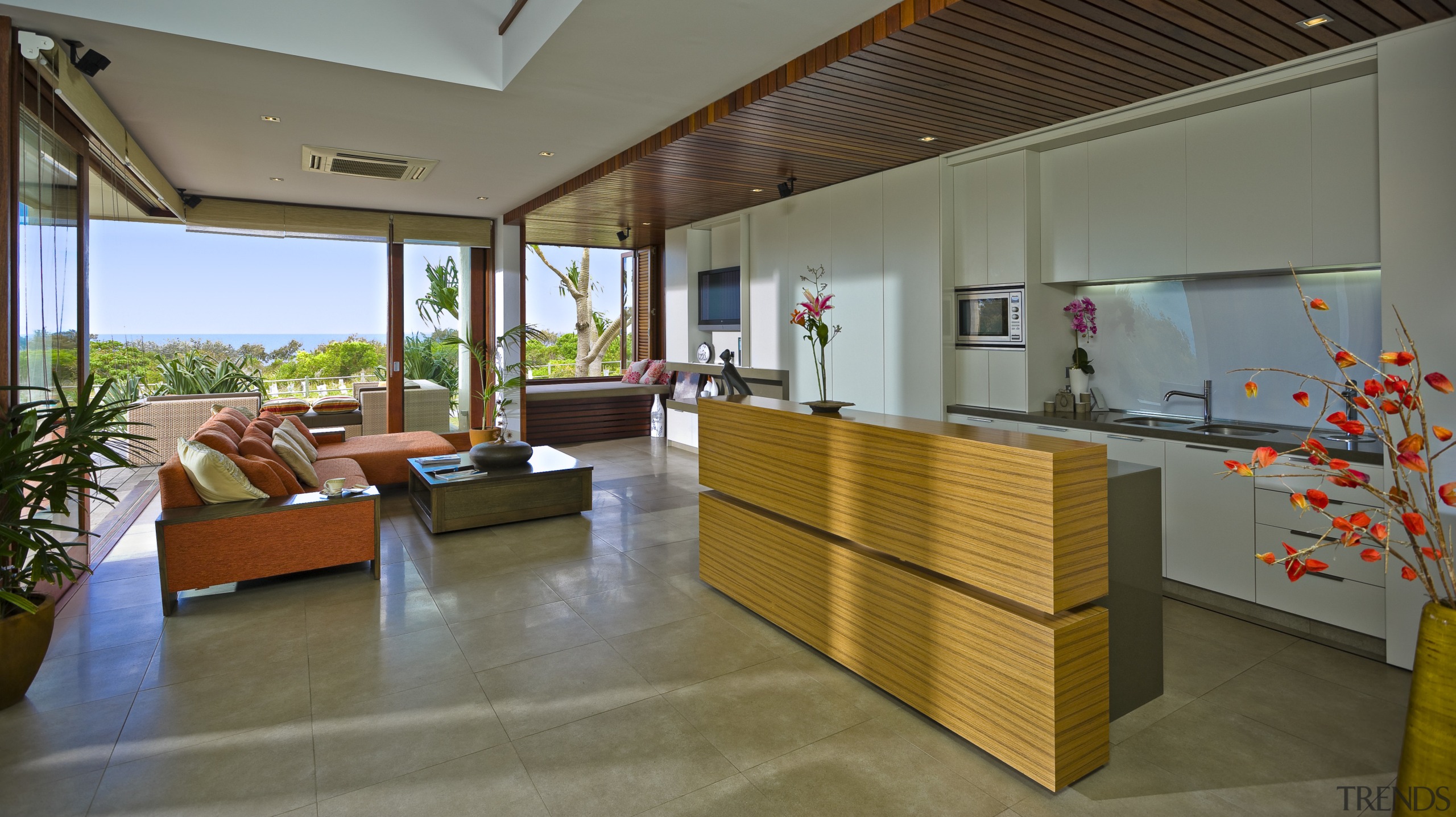 View of open-plan kitchen area with kitchen island, interior design, lobby, real estate, gray, brown