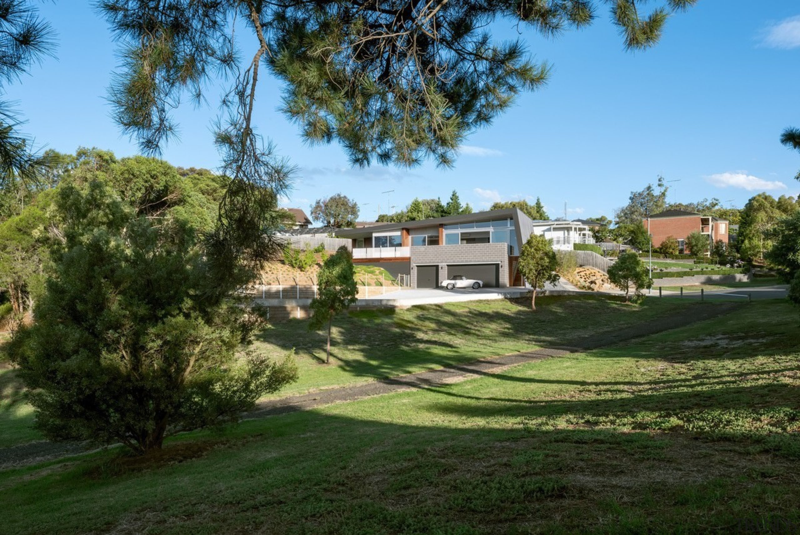 A view of the home from the adjacent area, cottage, estate, farmhouse, home, house, land lot, landscape, lawn, plantation, property, real estate, residential area, sky, suburb, tree, villa, yard, brown, teal