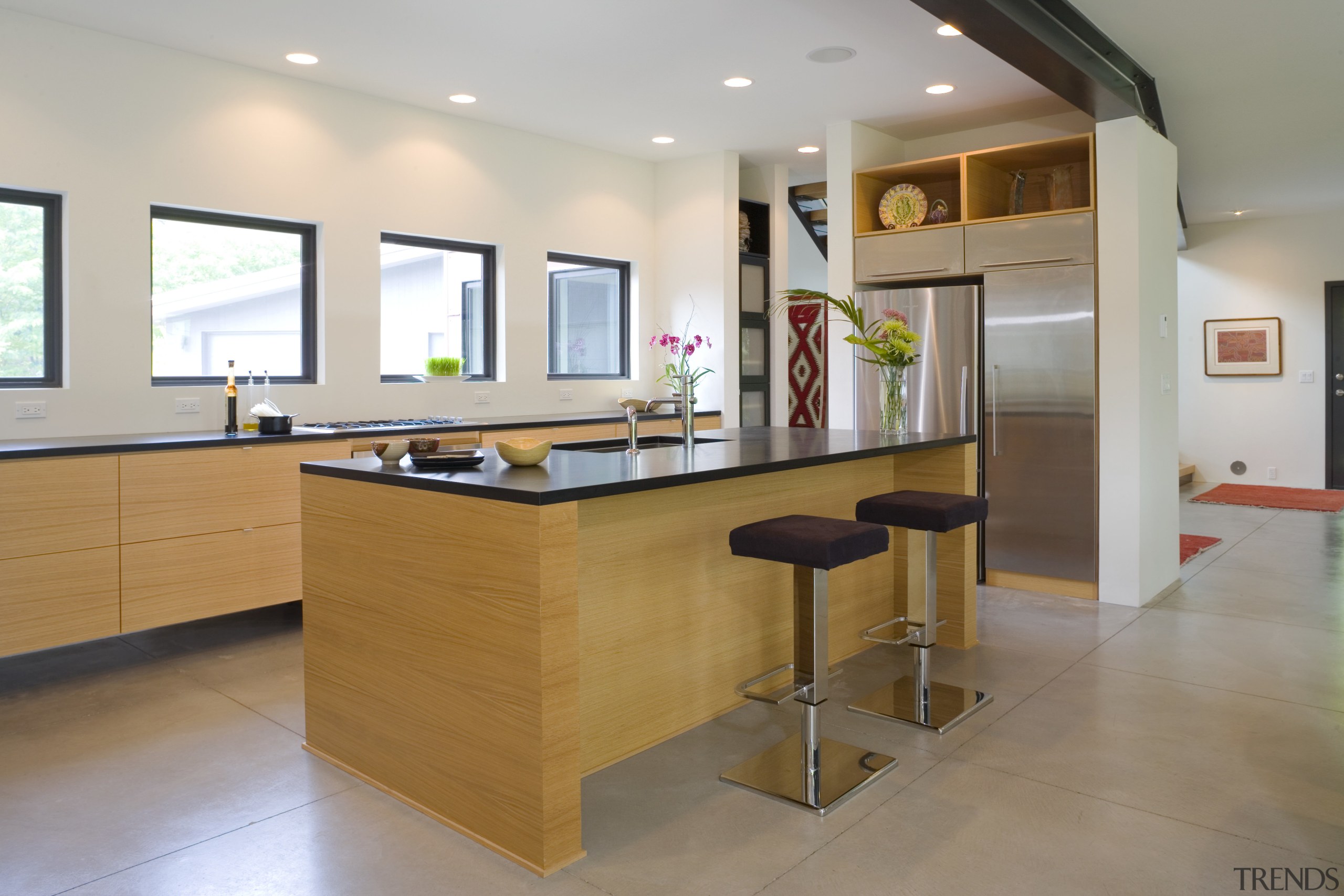 Countertops are made from an eco-friendly product that cabinetry, countertop, floor, flooring, interior design, kitchen, real estate, room, table, gray, brown