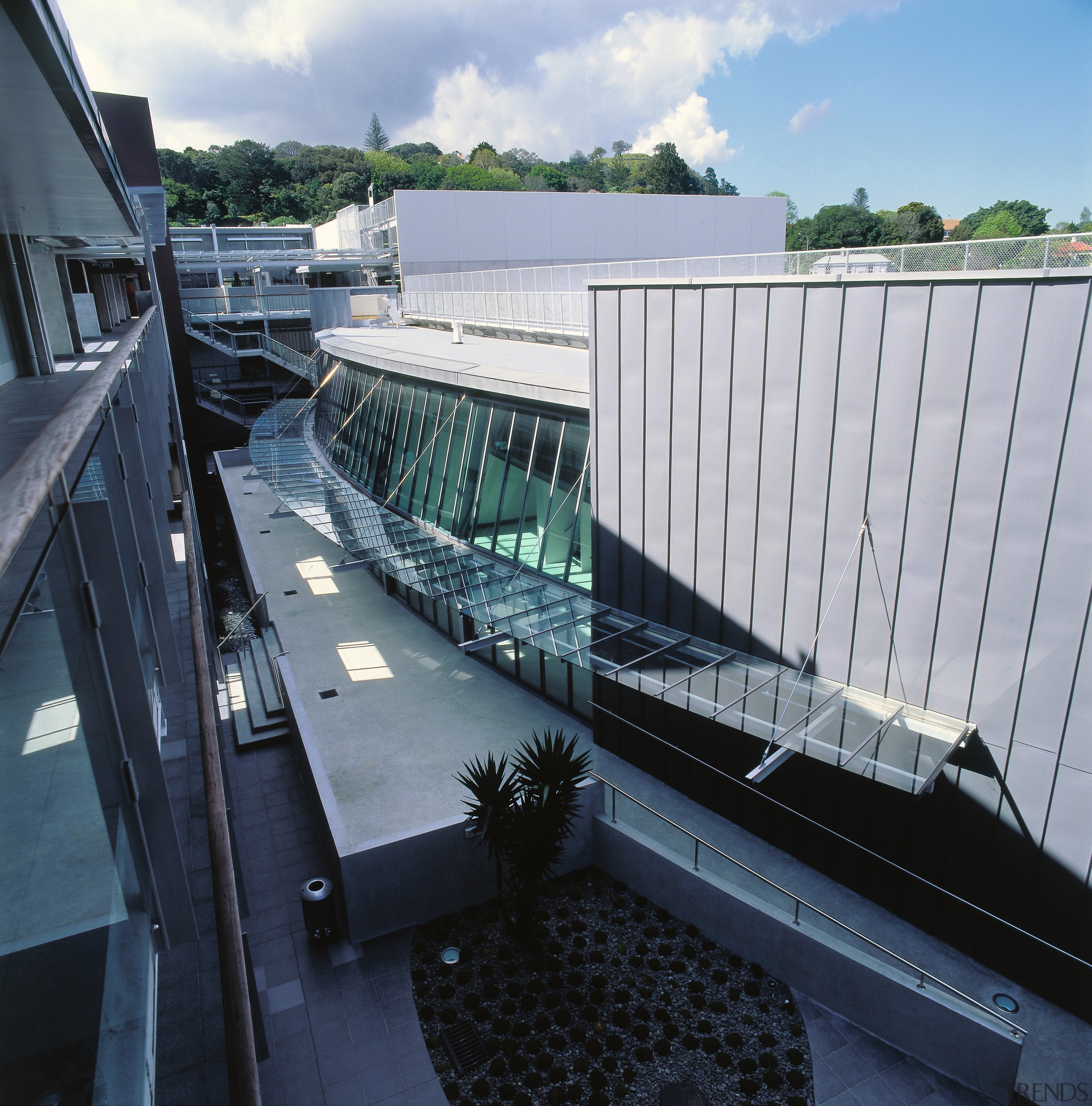 An exterior view of the Zone23 building. - architecture, bridge, fixed link, handrail, water, black, gray