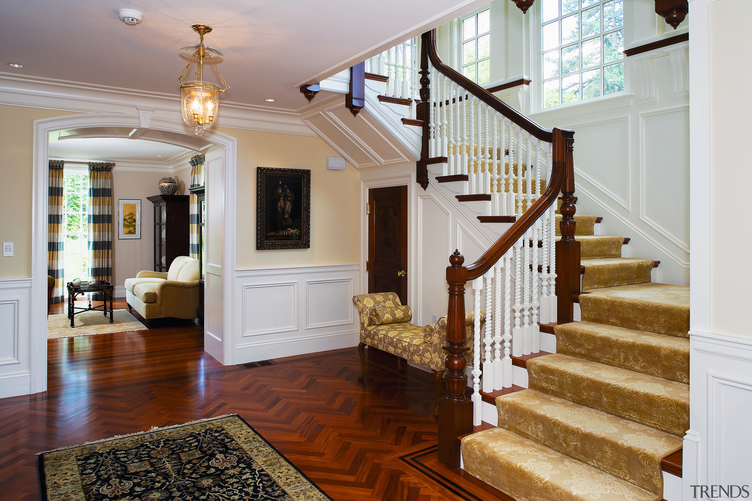 view of the entrance foyer featuring lead sidelight baluster, ceiling, estate, floor, flooring, handrail, hardwood, home, interior design, living room, lobby, property, real estate, stairs, wood, wood flooring, gray, brown