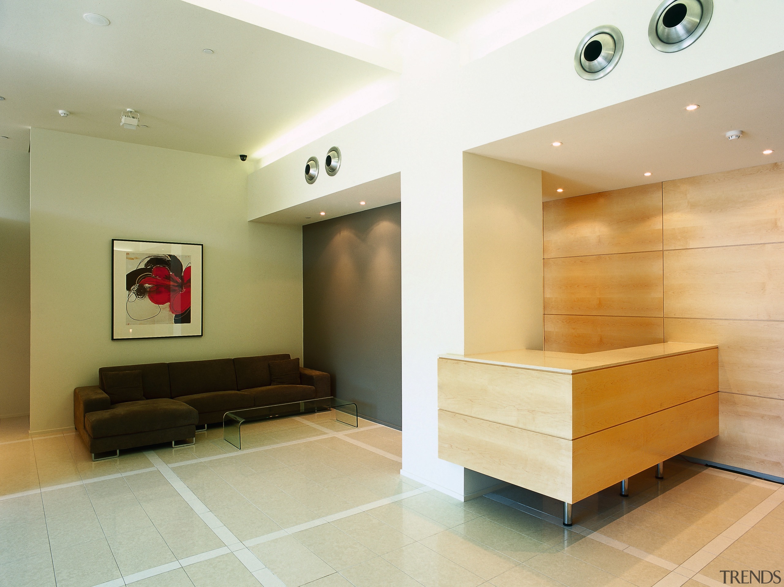 view of this apartment that has a sleek ceiling, floor, flooring, interior design, living room, lobby, wall, white, orange