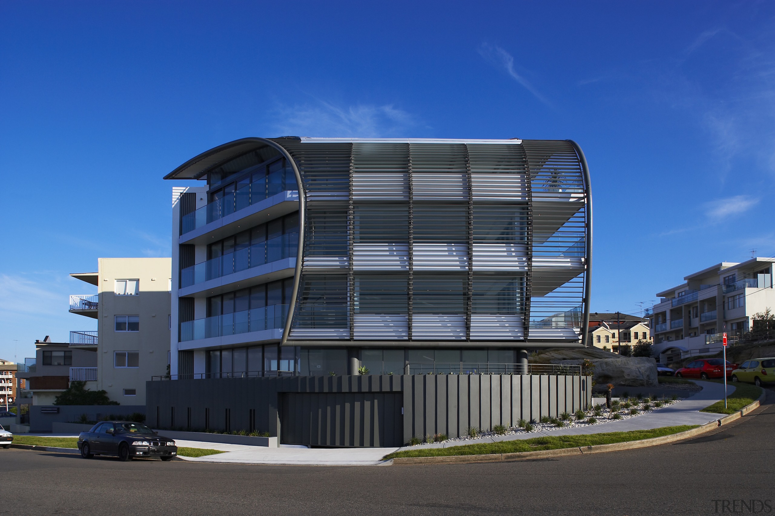 Exterior view of a Sydney apartment building which apartment, architecture, building, city, commercial building, condominium, corporate headquarters, daytime, facade, headquarters, home, house, metropolitan area, mixed use, neighbourhood, real estate, residential area, sky, window, blue, black