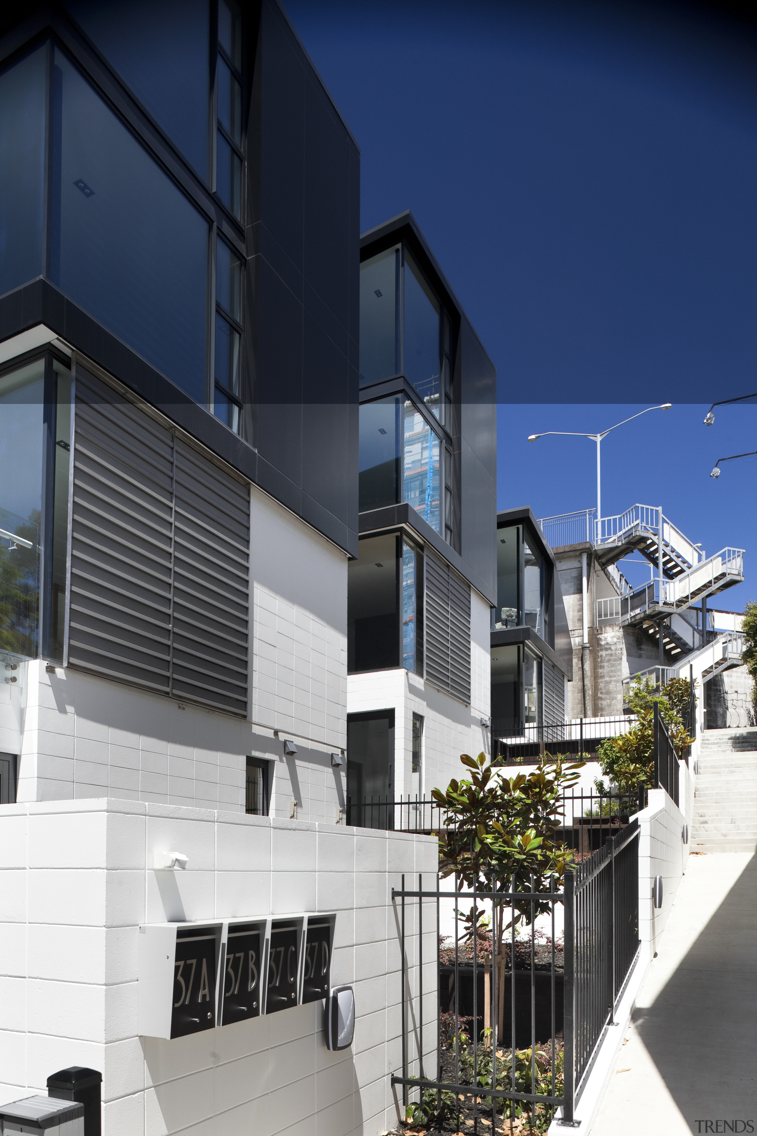 View of exterior with black and white walls apartment, architecture, building, commercial building, condominium, facade, home, house, mixed use, neighbourhood, real estate, residential area, window, blue, black