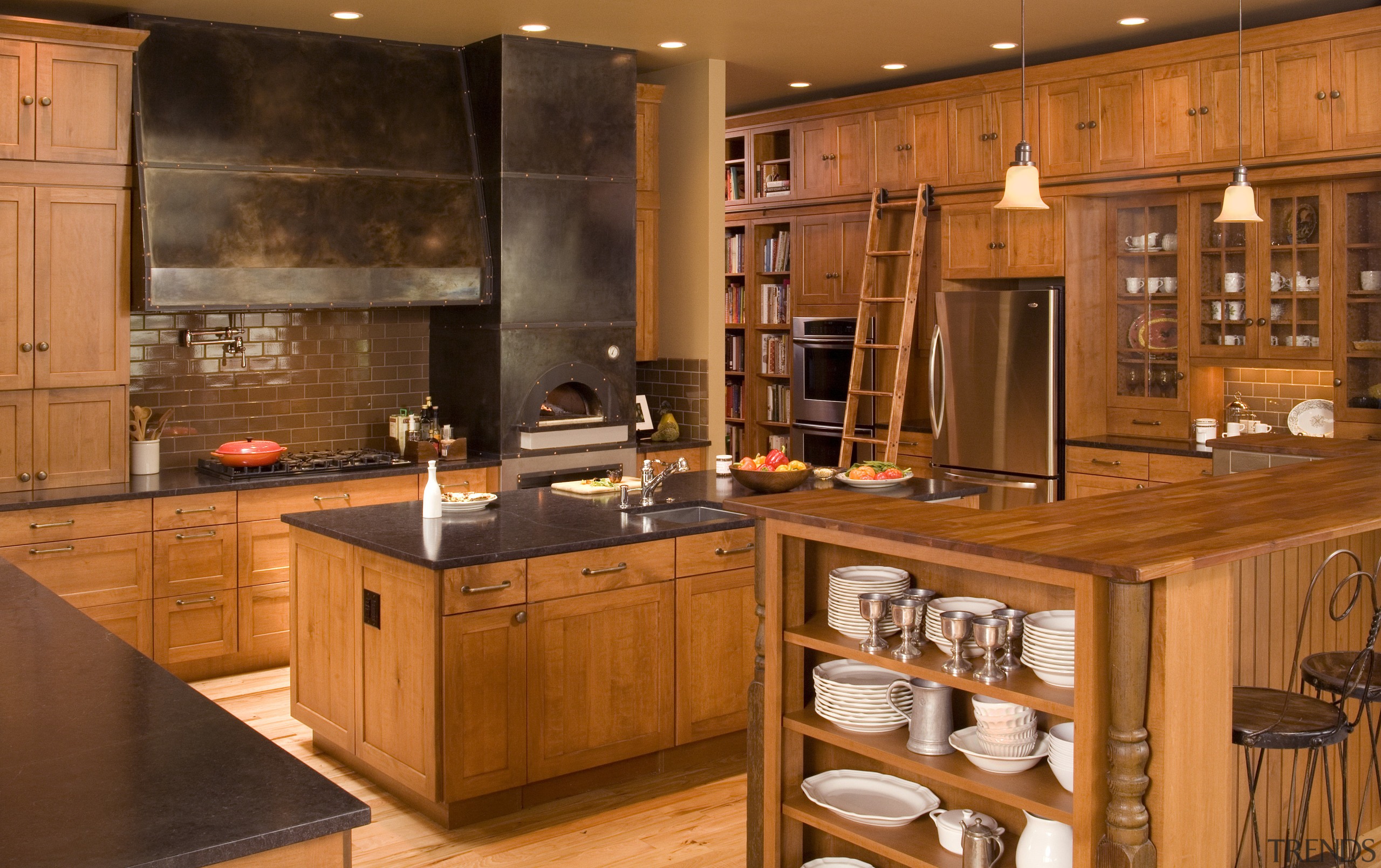 View of a Northwestern-styled kitchen with extensive wood cabinetry, countertop, cuisine classique, flooring, hardwood, interior design, kitchen, room, wood stain, brown