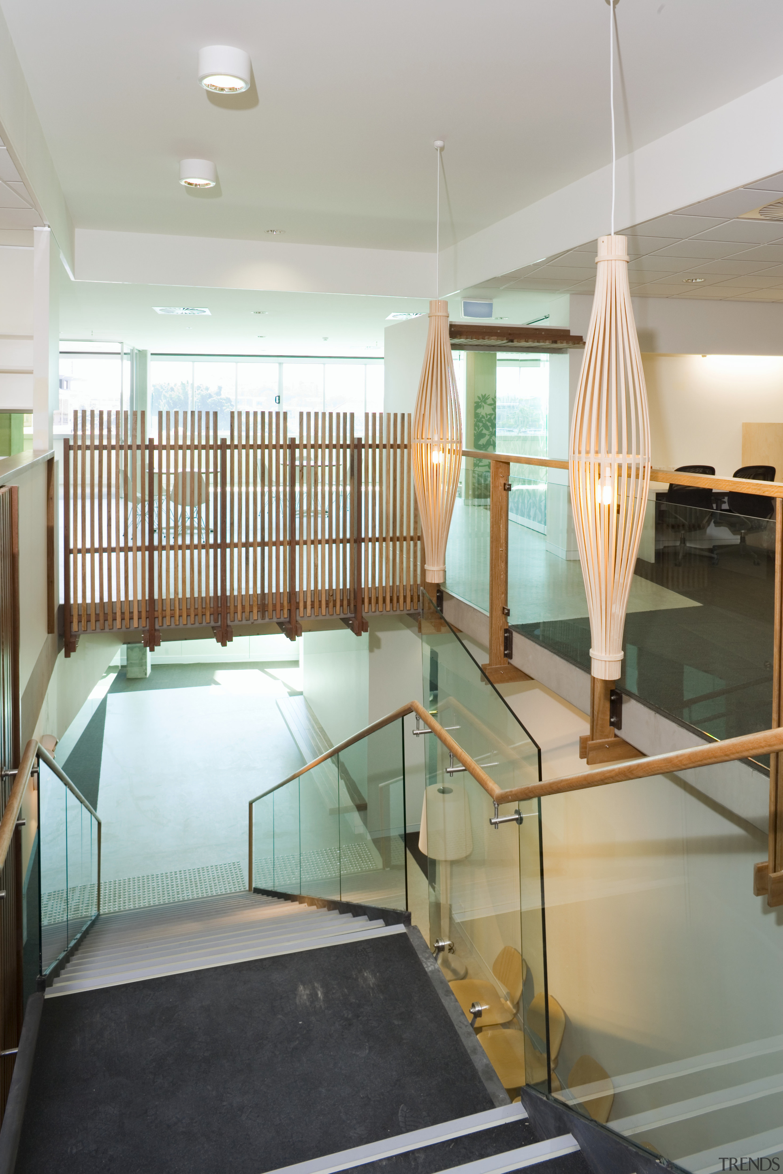 A view of the staircase featuring glass balustrading architecture, ceiling, floor, flooring, glass, house, interior design, room, gray