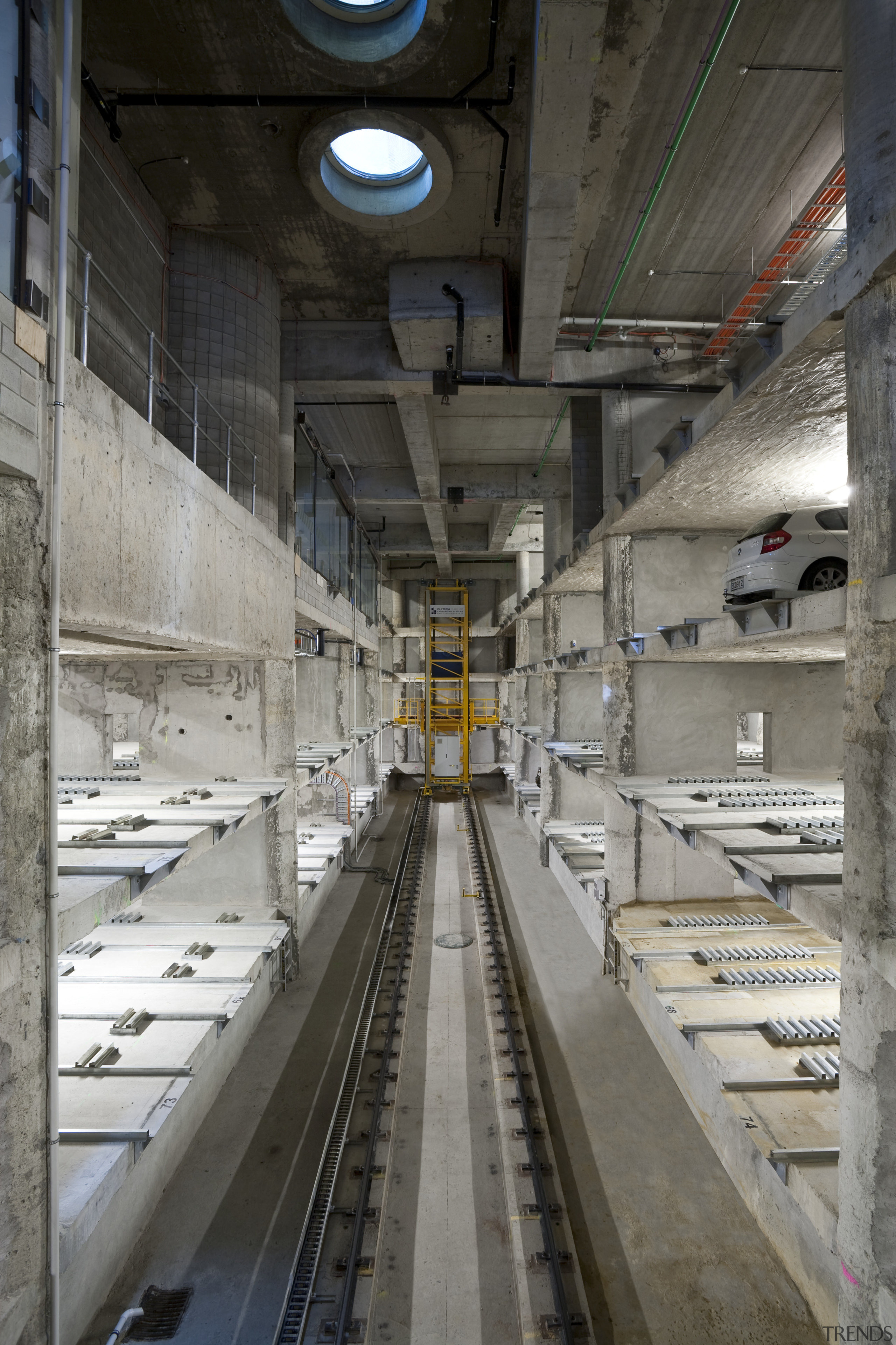 View of the car-stacking parking system in the public transport, track, gray, black