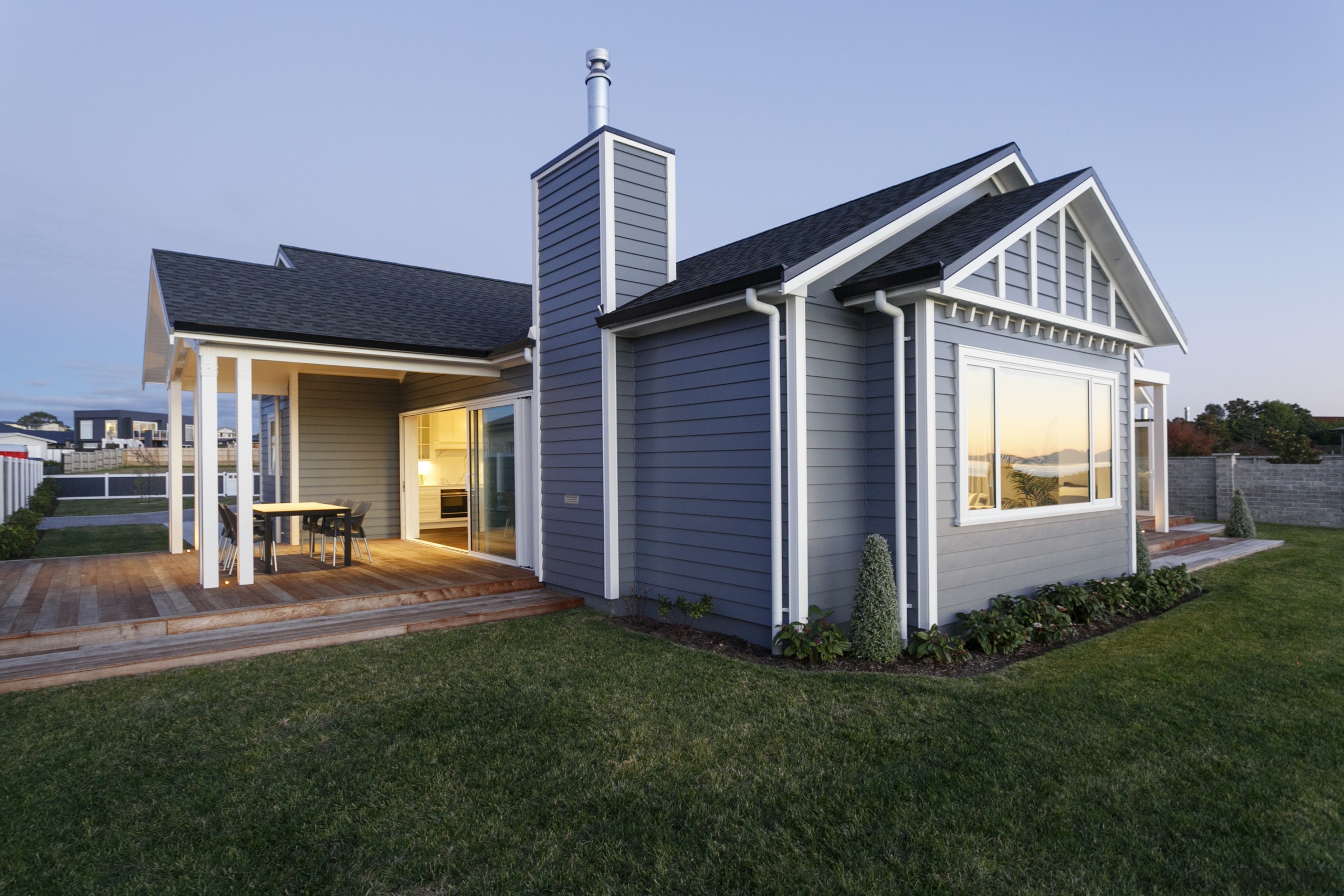 Dusk falls on the couple's dream lakeside home 