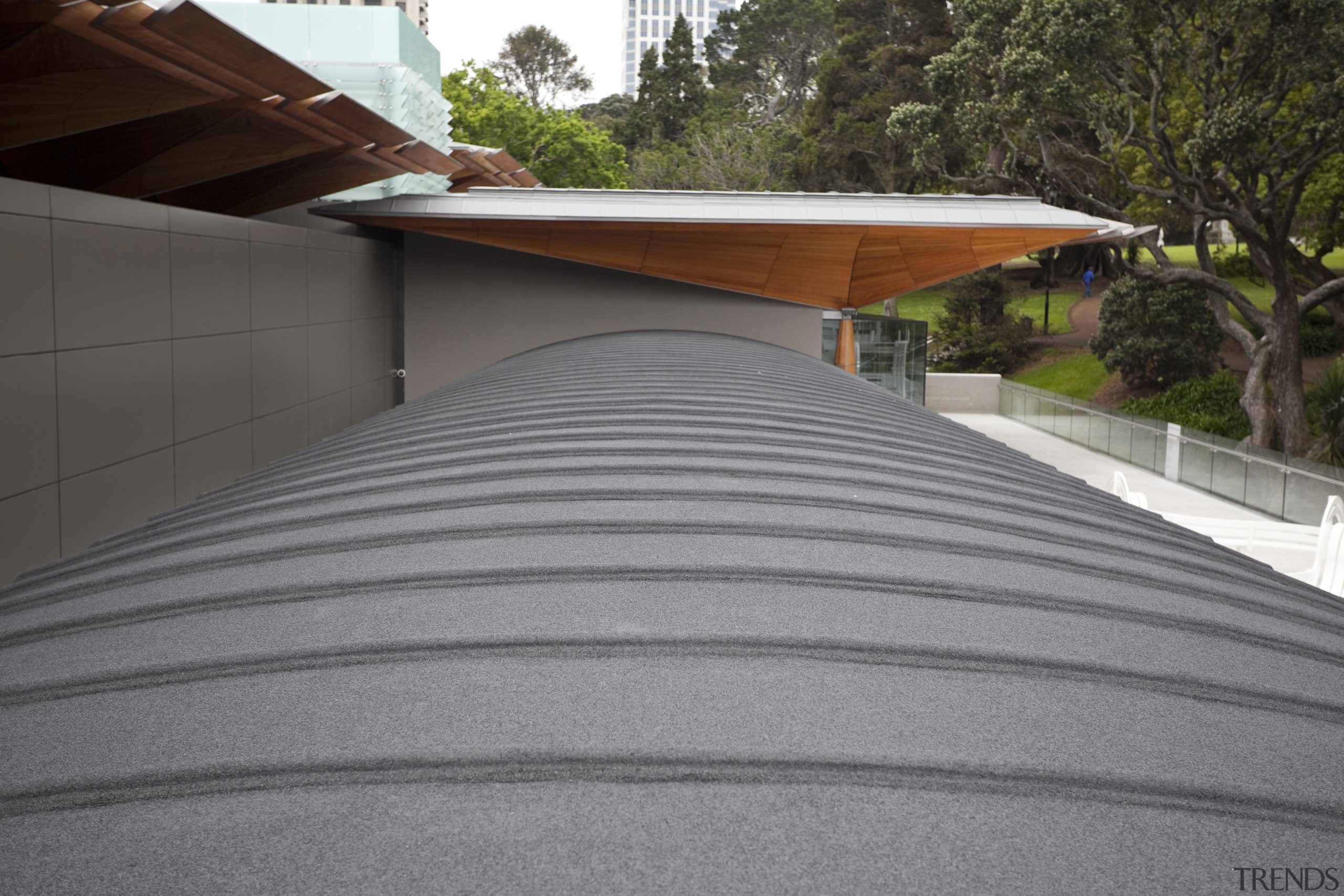 Auckland Waterproofing ensured that this, the Auckland Art architecture, asphalt, automotive exterior, daylighting, house, outdoor structure, road surface, roof, wood, gray