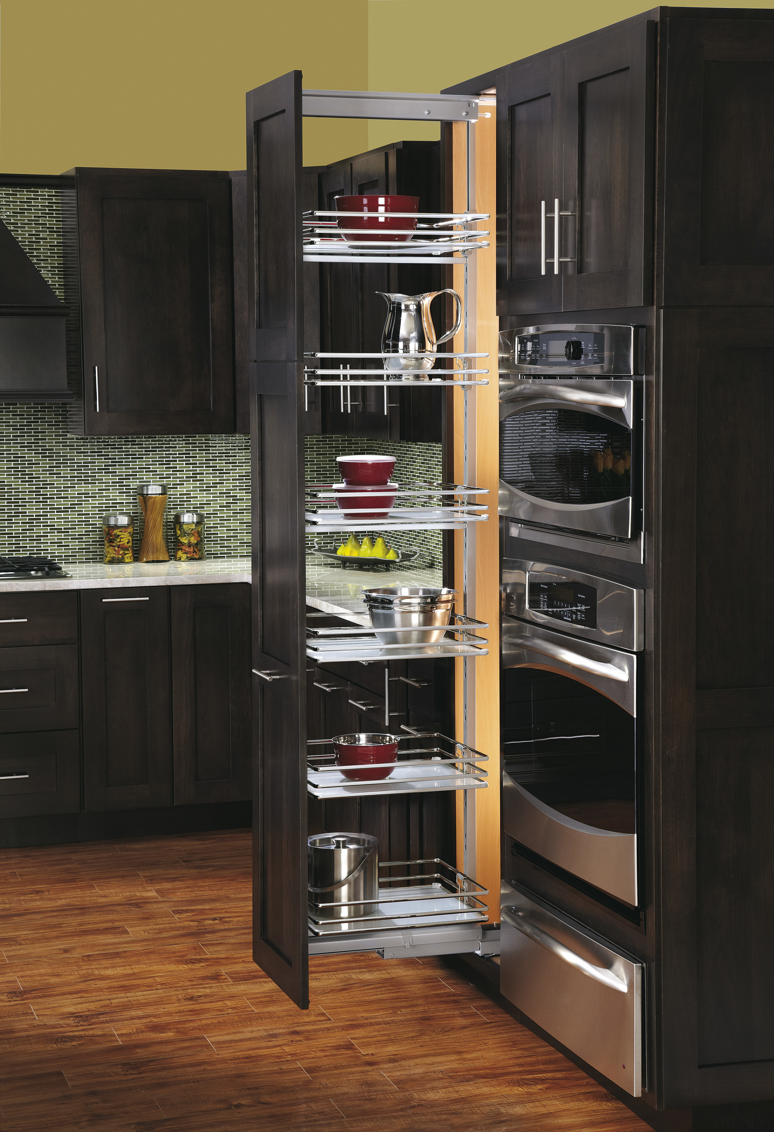 View of kitchen organisation products by Rev-A-Shelf, including cabinetry, closet, countertop, display case, furniture, kitchen, kitchen appliance, refrigerator, shelf, shelving, black