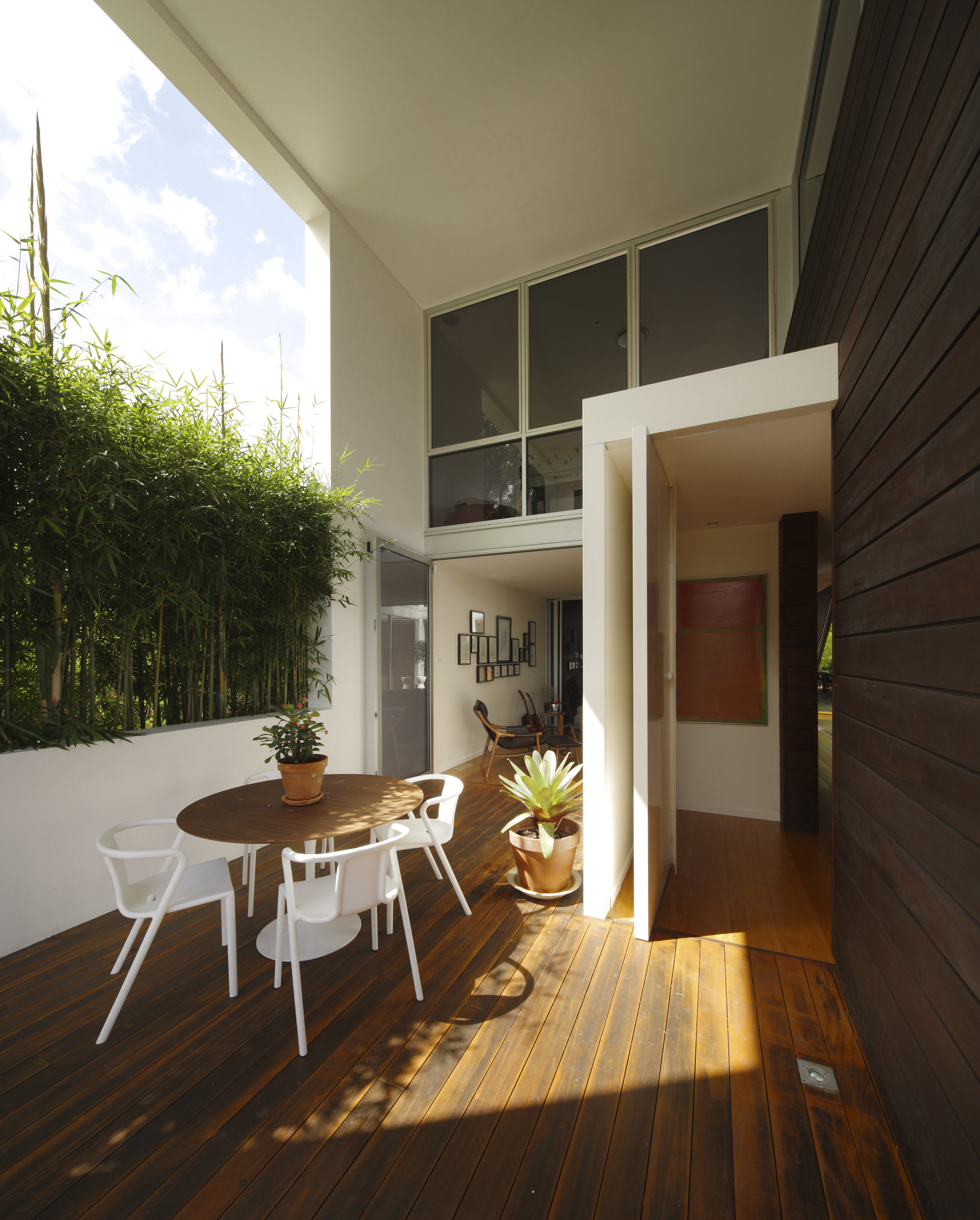 View of outdoor seating area with wooden floors apartment, architecture, daylighting, floor, hardwood, house, interior design, living room, real estate, window, wood, wood flooring, brown