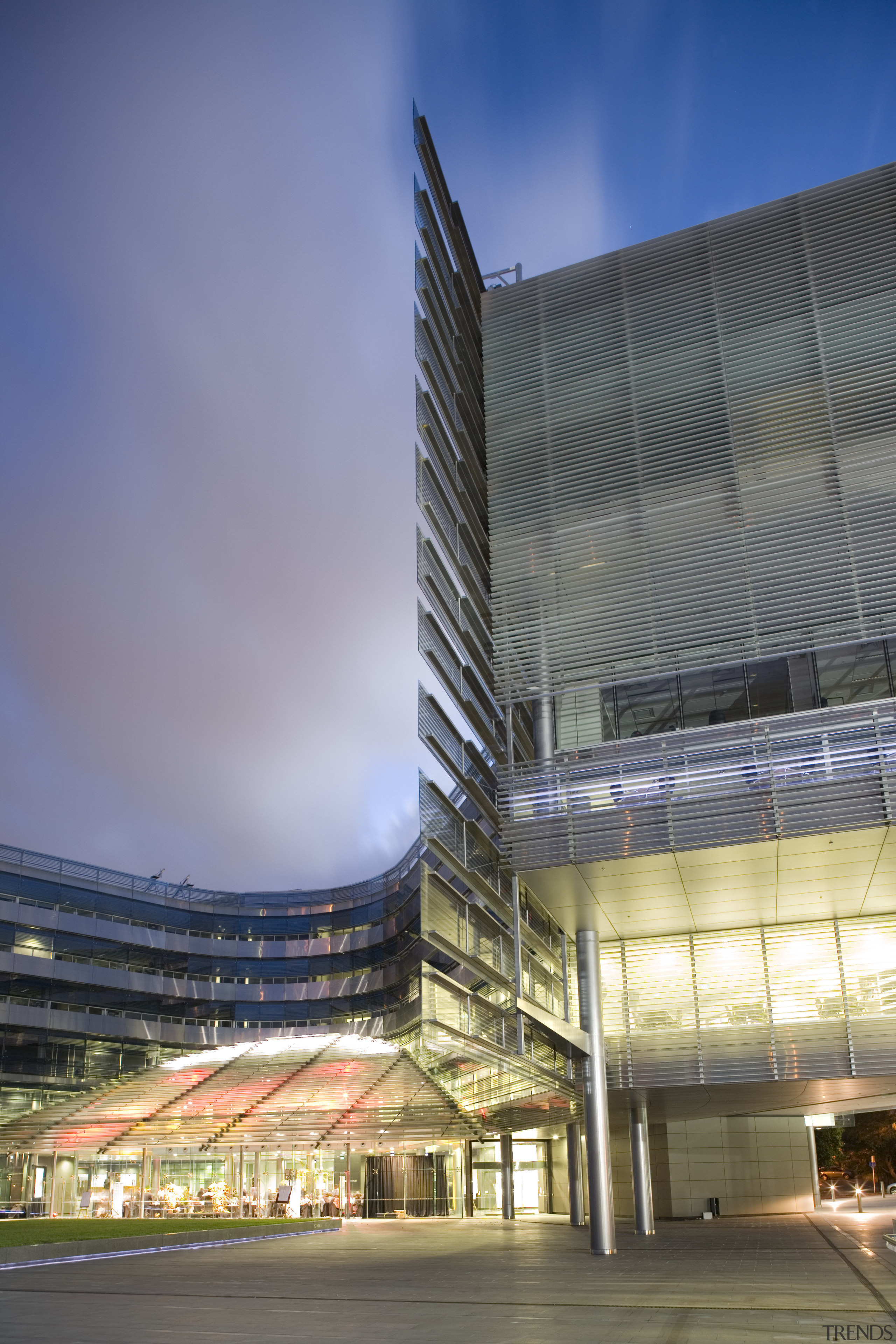 View of the exterior of the Owen G architecture, building, city, commercial building, condominium, convention center, corporate headquarters, daytime, facade, headquarters, landmark, metropolis, metropolitan area, mixed use, reflection, sky, skyscraper, structure, blue