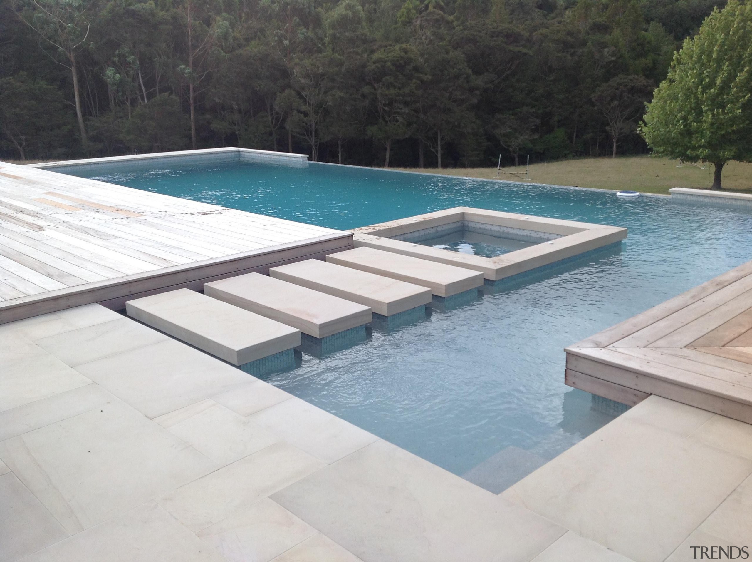 Concrete pool with feature stepping stones to built composite material, daylighting, leisure, outdoor furniture, property, sunlounger, swimming pool, water, water resources, white