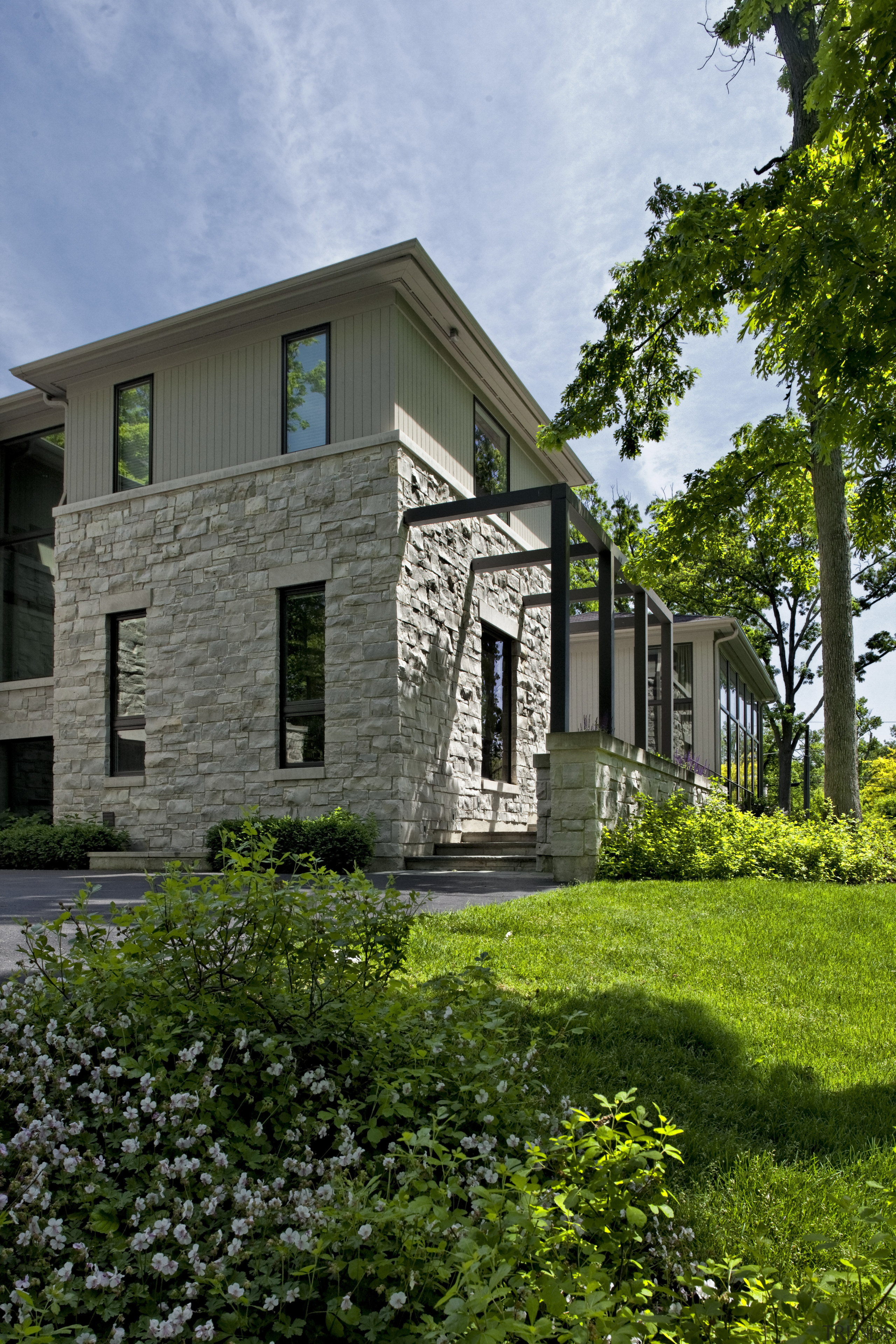 stone outside with paving and lawn - stone architecture, building, cottage, estate, facade, farmhouse, grass, home, house, neighbourhood, property, real estate, residential area, window, green