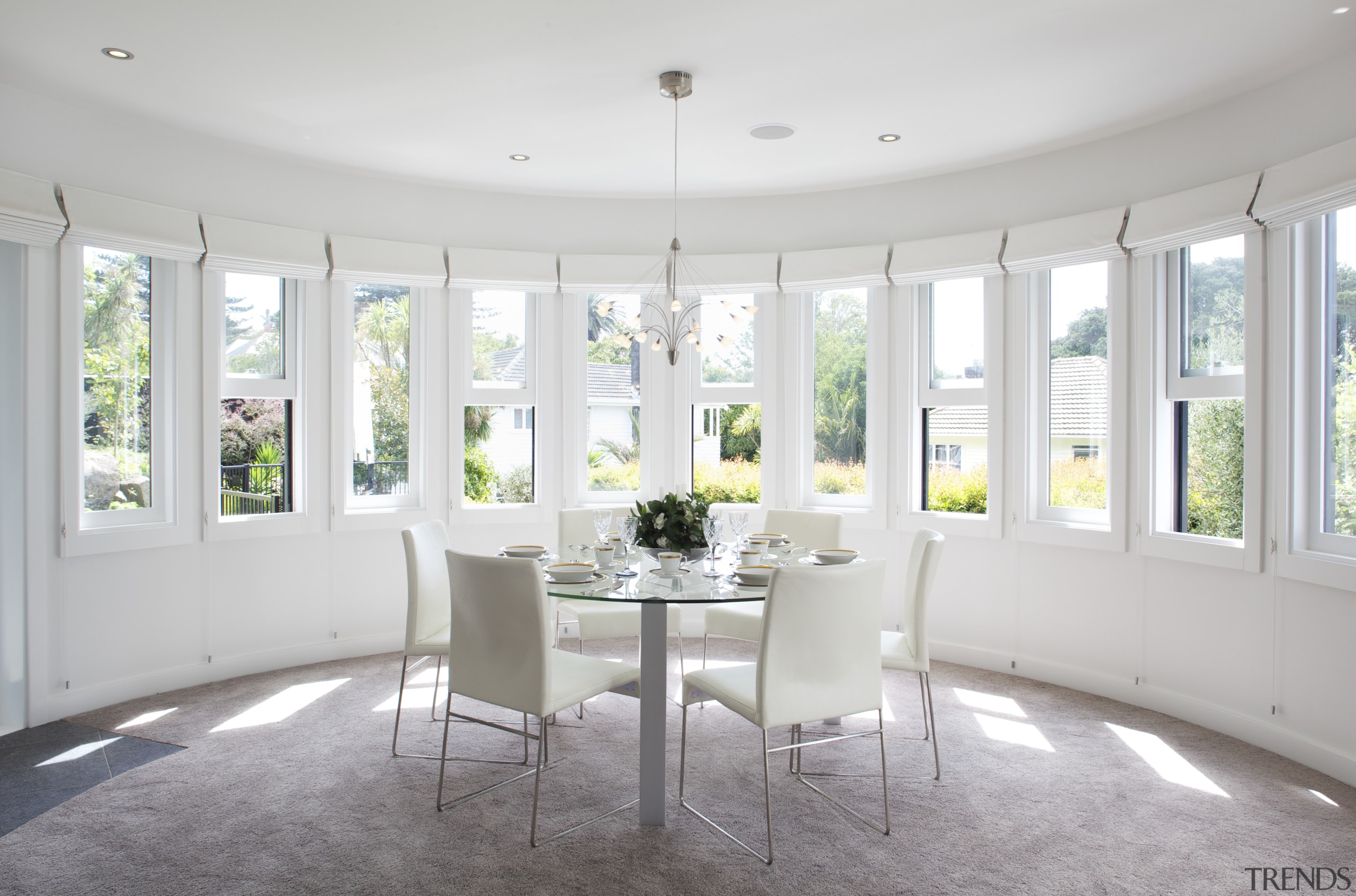 The dining area in this remodeled home  ceiling, dining room, estate, home, house, interior design, real estate, room, table, window, white, gray